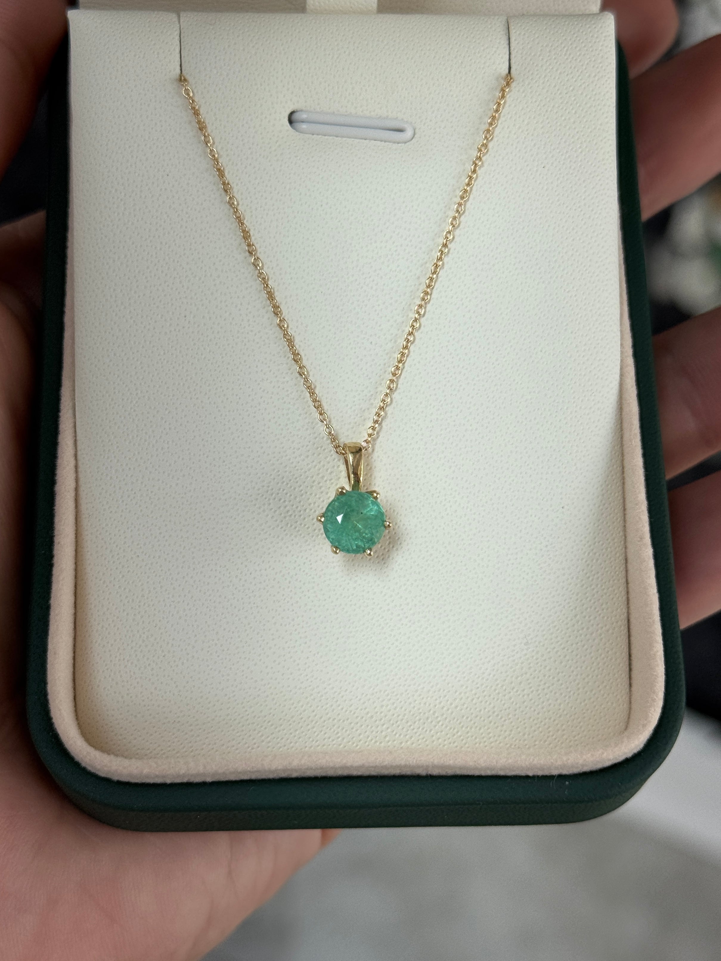 14K gold Tiffany-style emerald solitaire necklace featuring a 1.14ct round Colombian emerald gemstone.