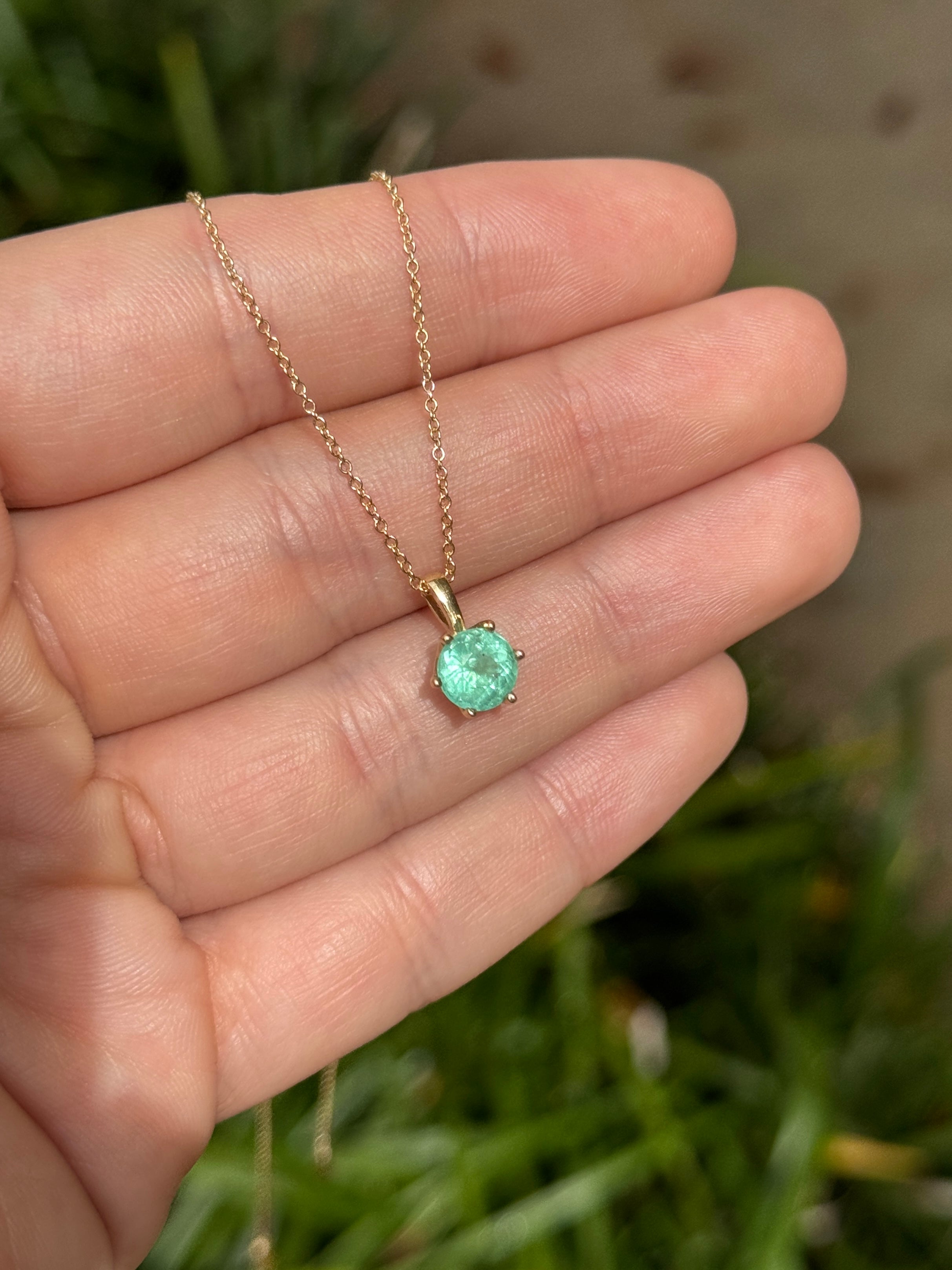 14K gold Tiffany-style emerald solitaire necklace with 1.14ct round emerald by JR Colombian Emeralds, showcasing the elegant jewelry piece.