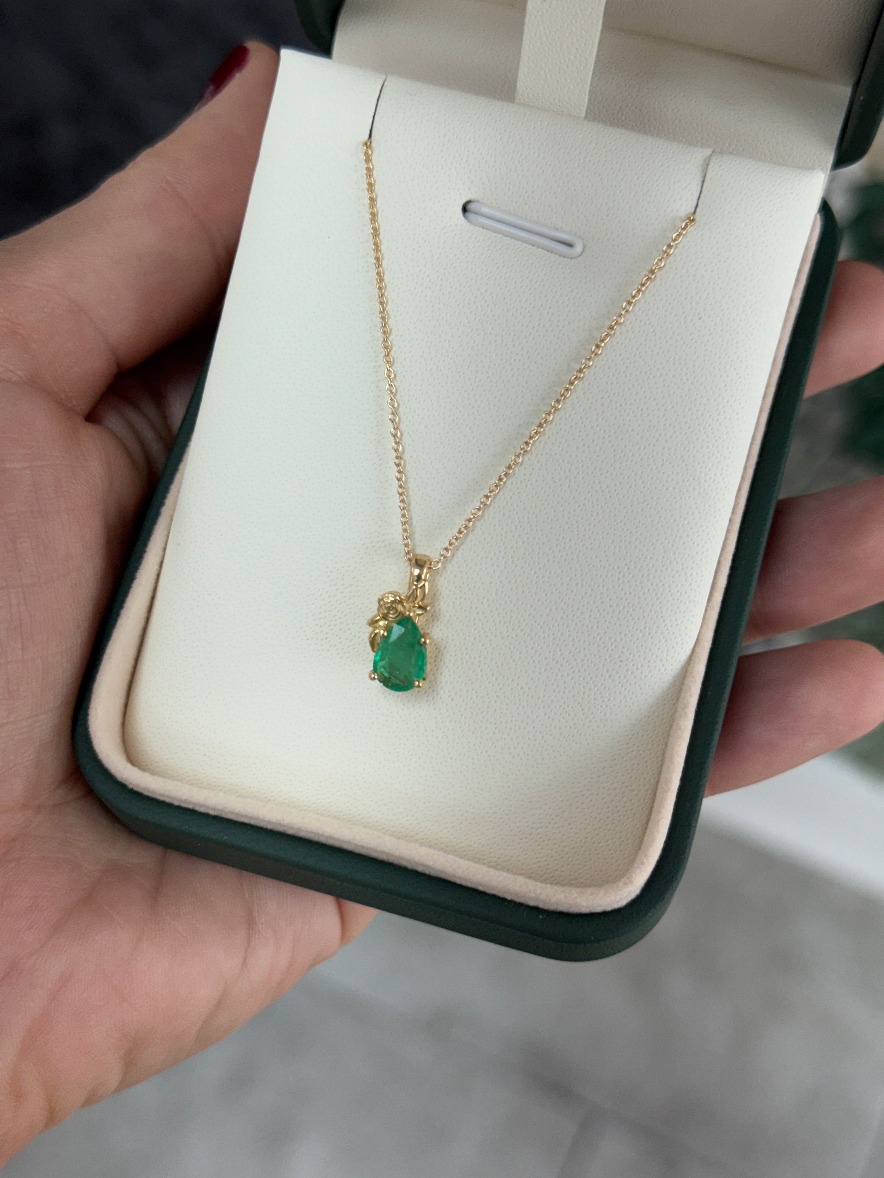 14K natural green pear cut emerald pendant necklace with floral solitaire setting by JR Colombian Emeralds.