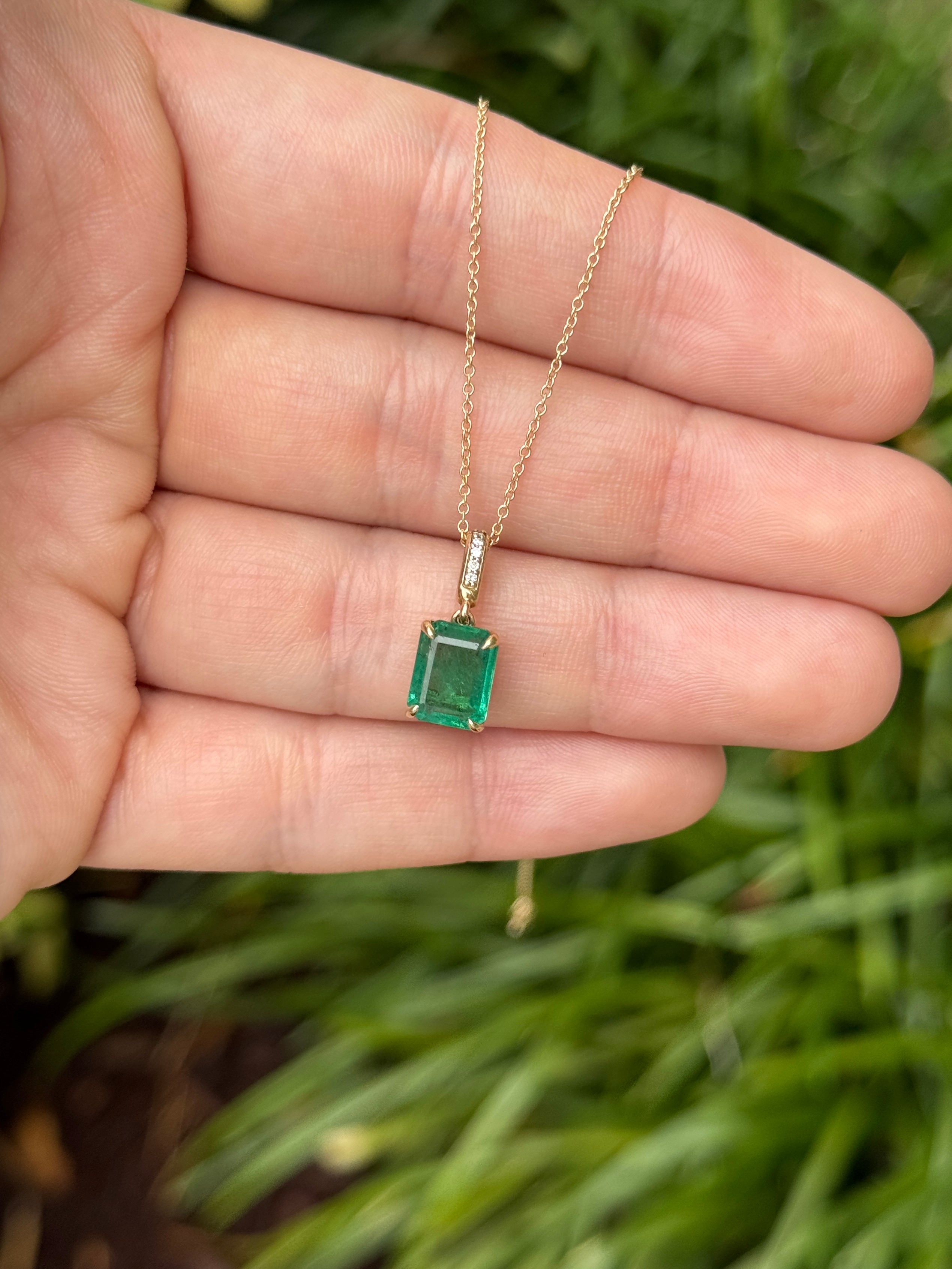 Emerald cut emerald pendant with diamond bail in 14K gold, featuring a 1.79tcw gemstone, by JR Colombian Emeralds.