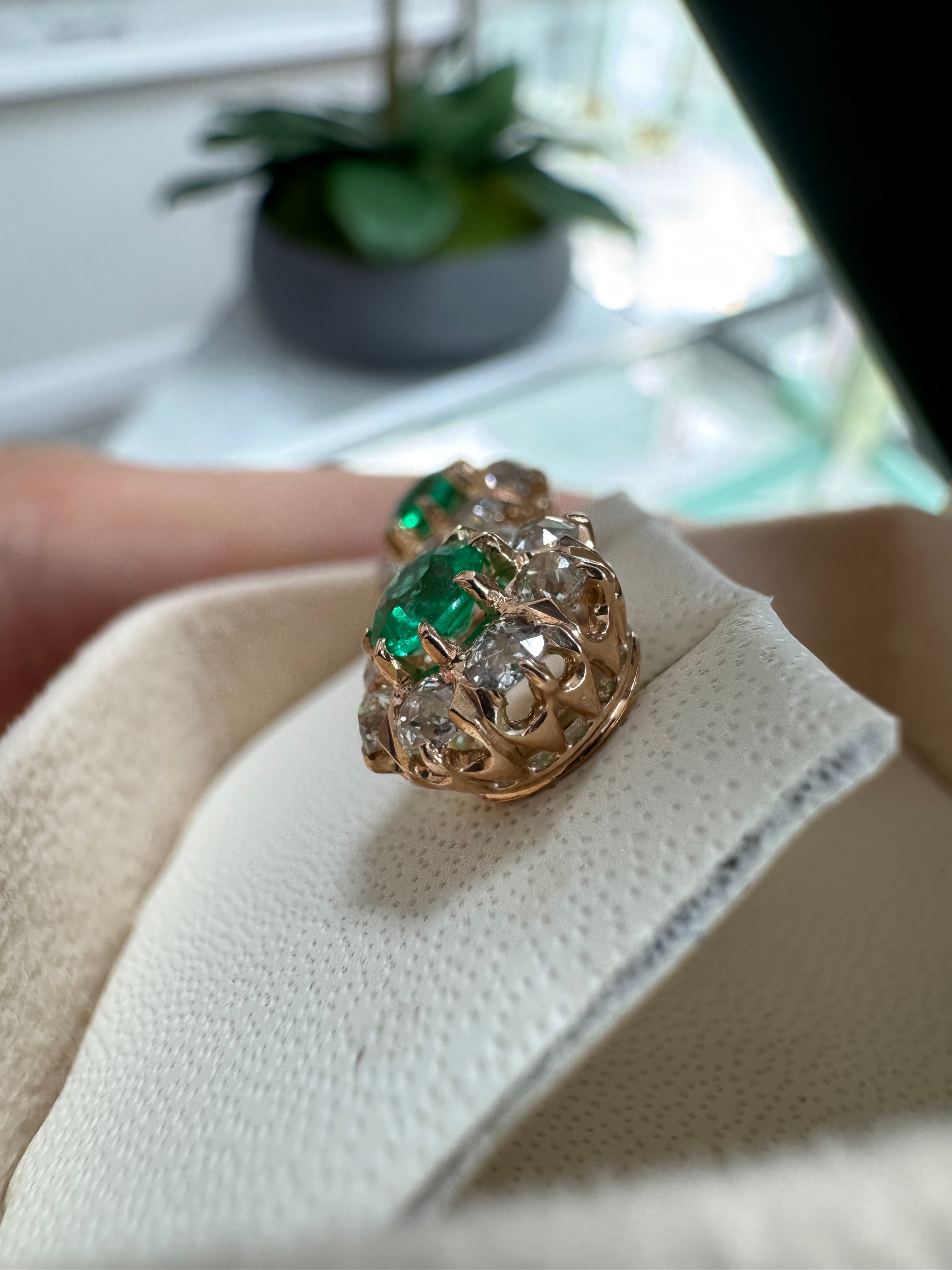 Vivid Colombian emerald halo stud earrings with old European cut diamonds in 14K gold from JR Colombian Emeralds.