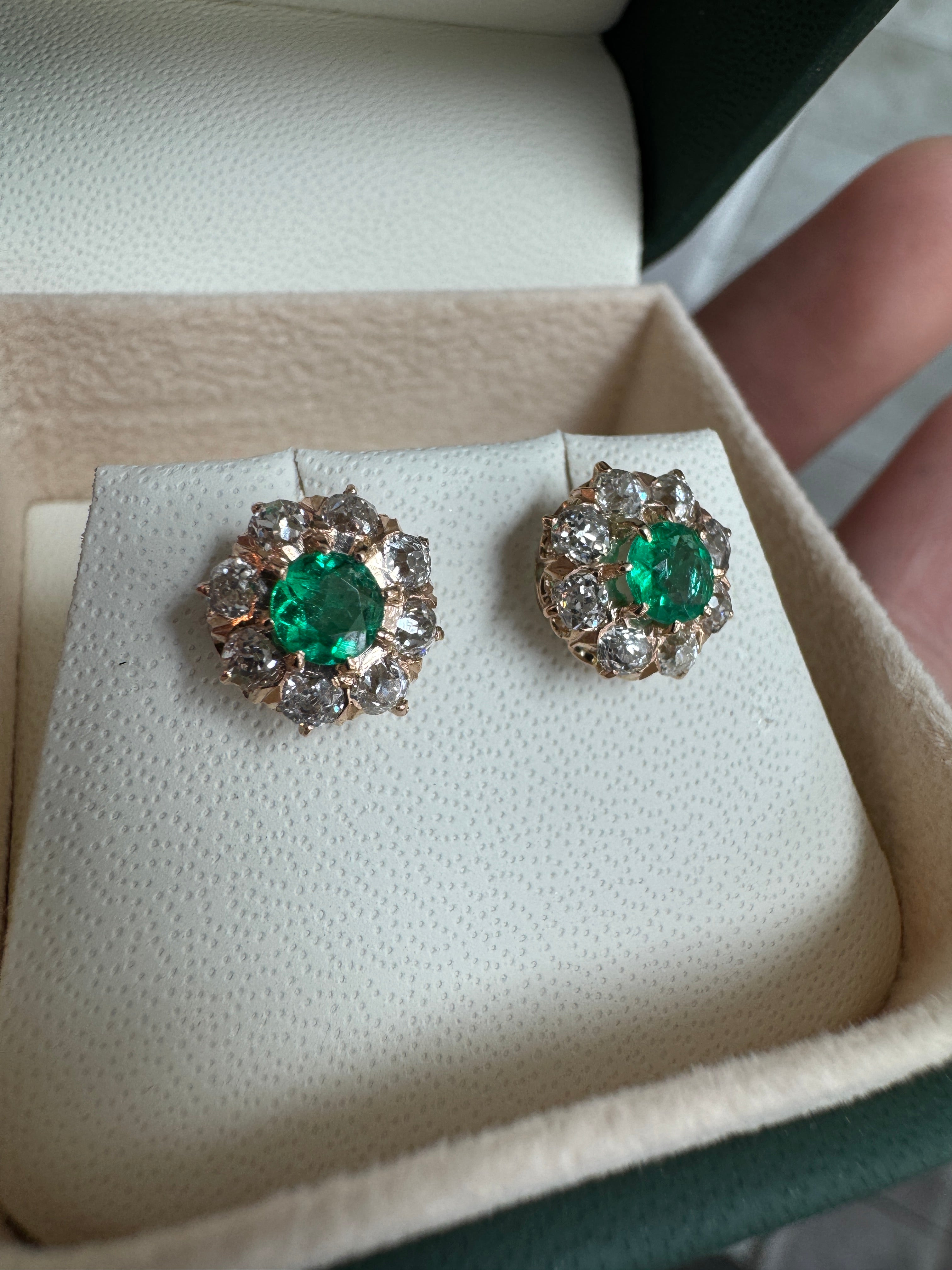 Vivid Colombian emerald halo stud earrings with old European cut diamonds in 14K gold from JR Colombian Emeralds.