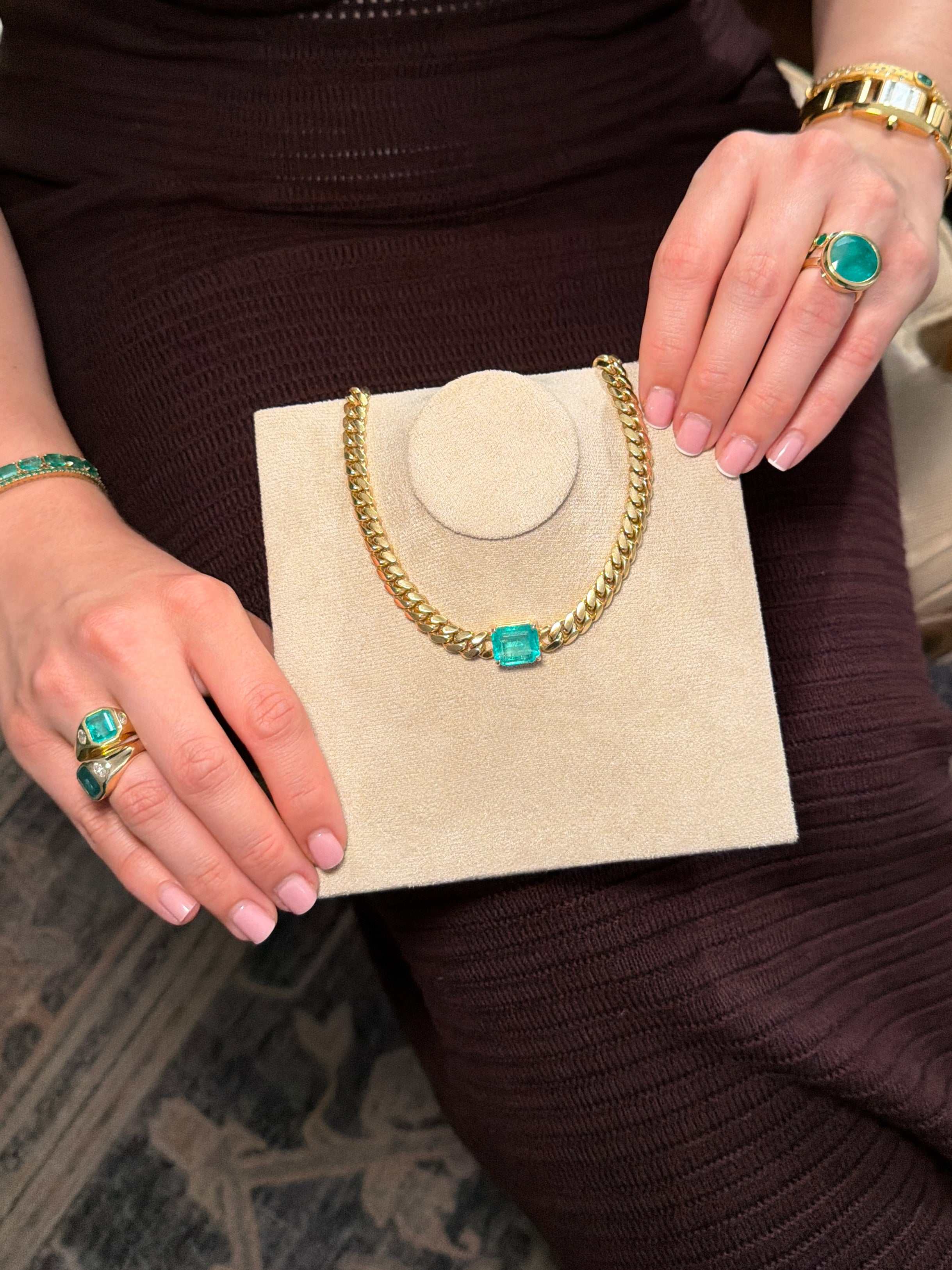 10 carat jumbo Colombian emerald Cuban link choker necklace with east-to-west pendant design, crafted in 14K gold by JR Colombian Emeralds.