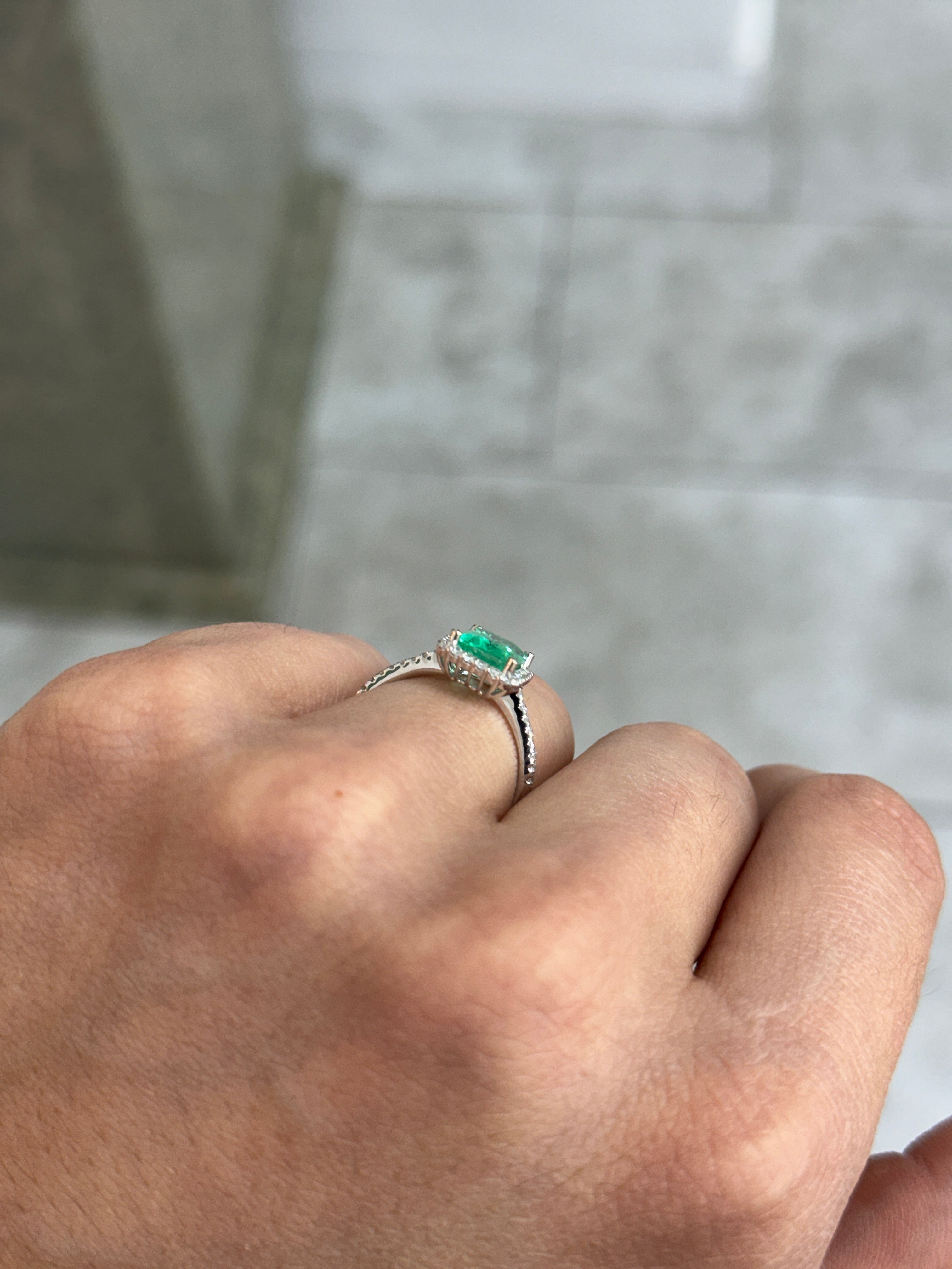 JR Colombian Emeralds 14K white gold engagement ring with 1.70tcw crystal clear Colombian emerald and diamond halo design.