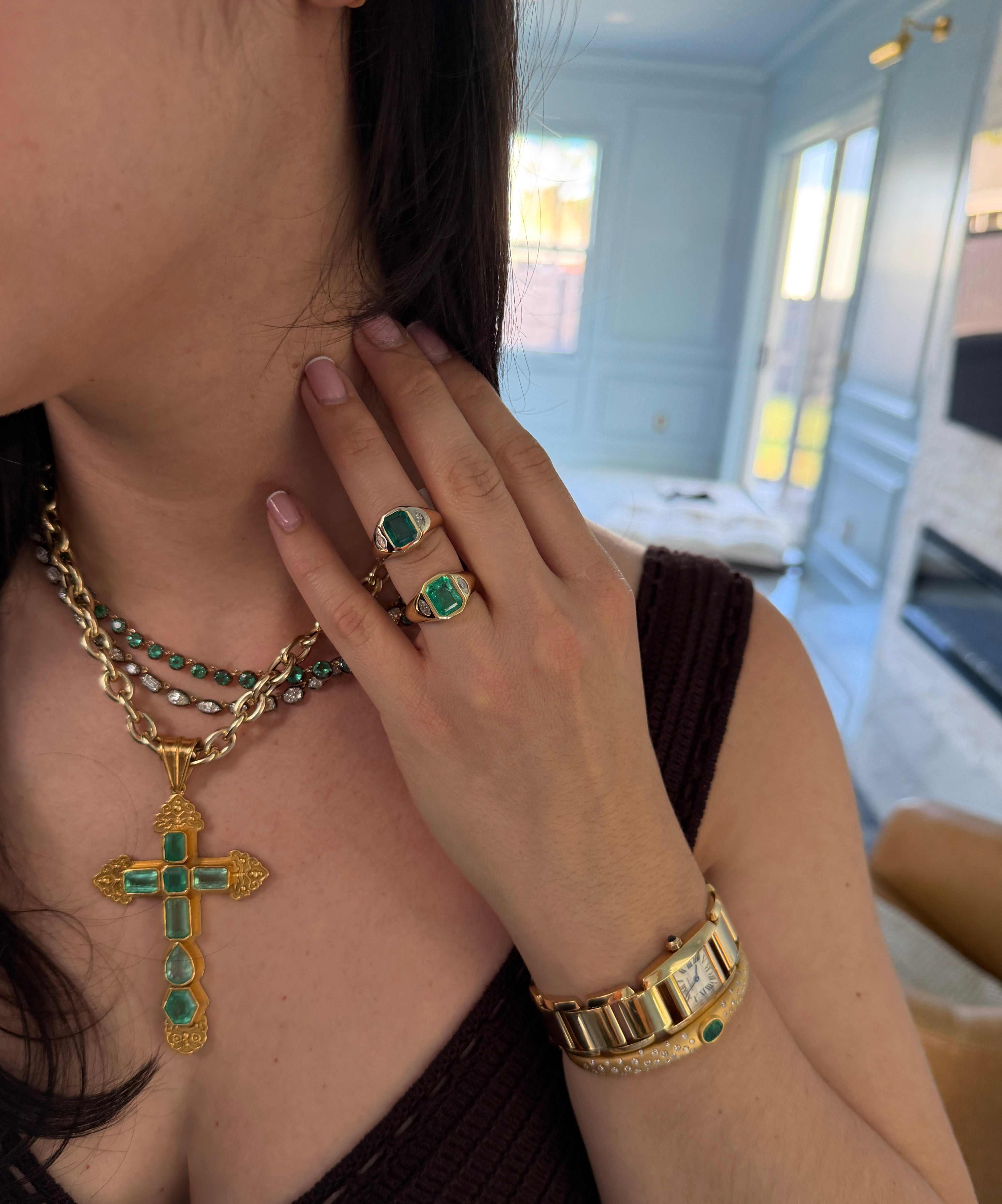 18K gold emerald cut and marquise diamond 3-stone bezel ring featuring vivid medium green natural Colombian emeralds and diamonds.