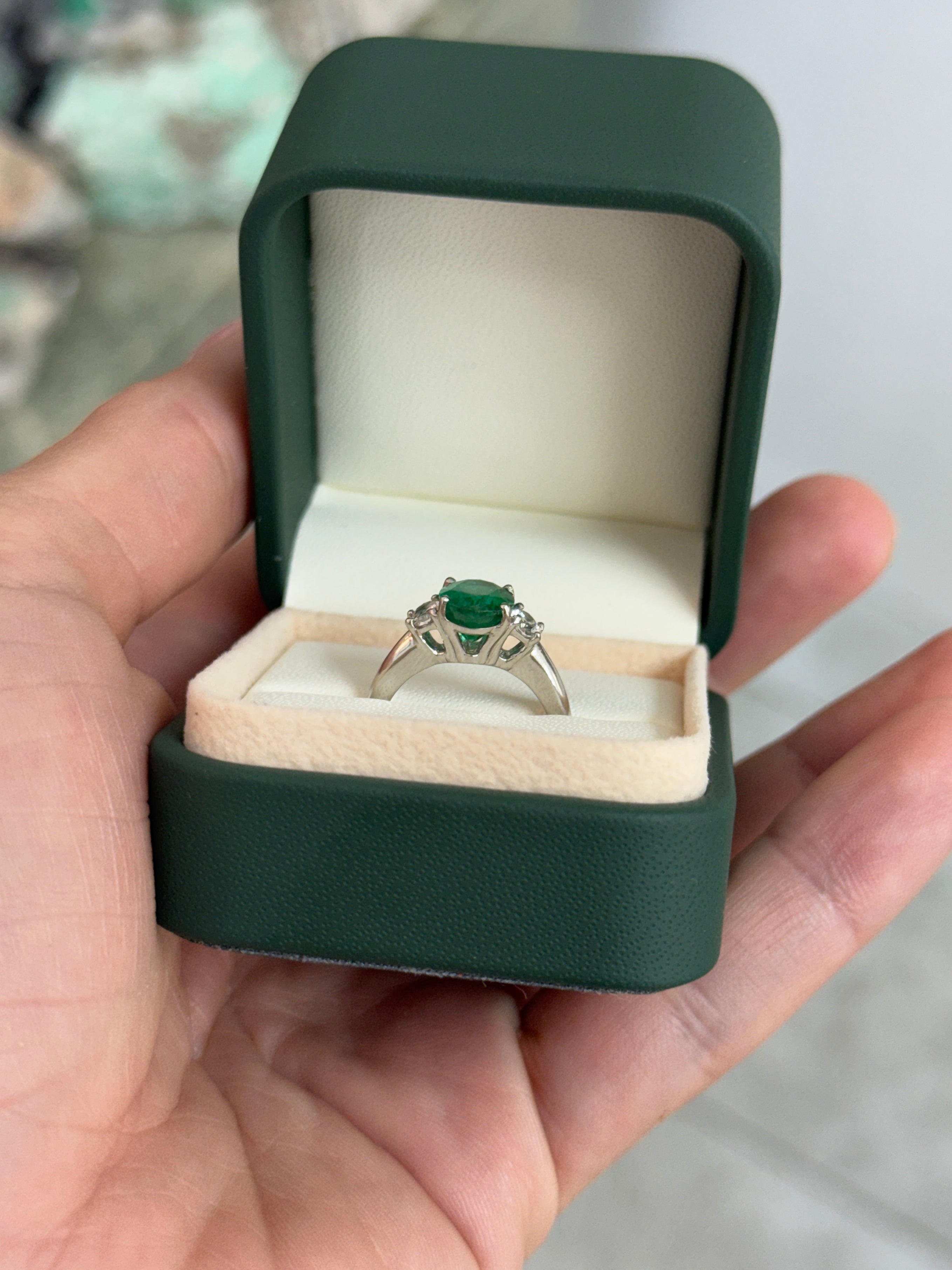 Vivid green oval emerald and diamond three-stone platinum ring with 2.97tcw from JR Colombian Emeralds.