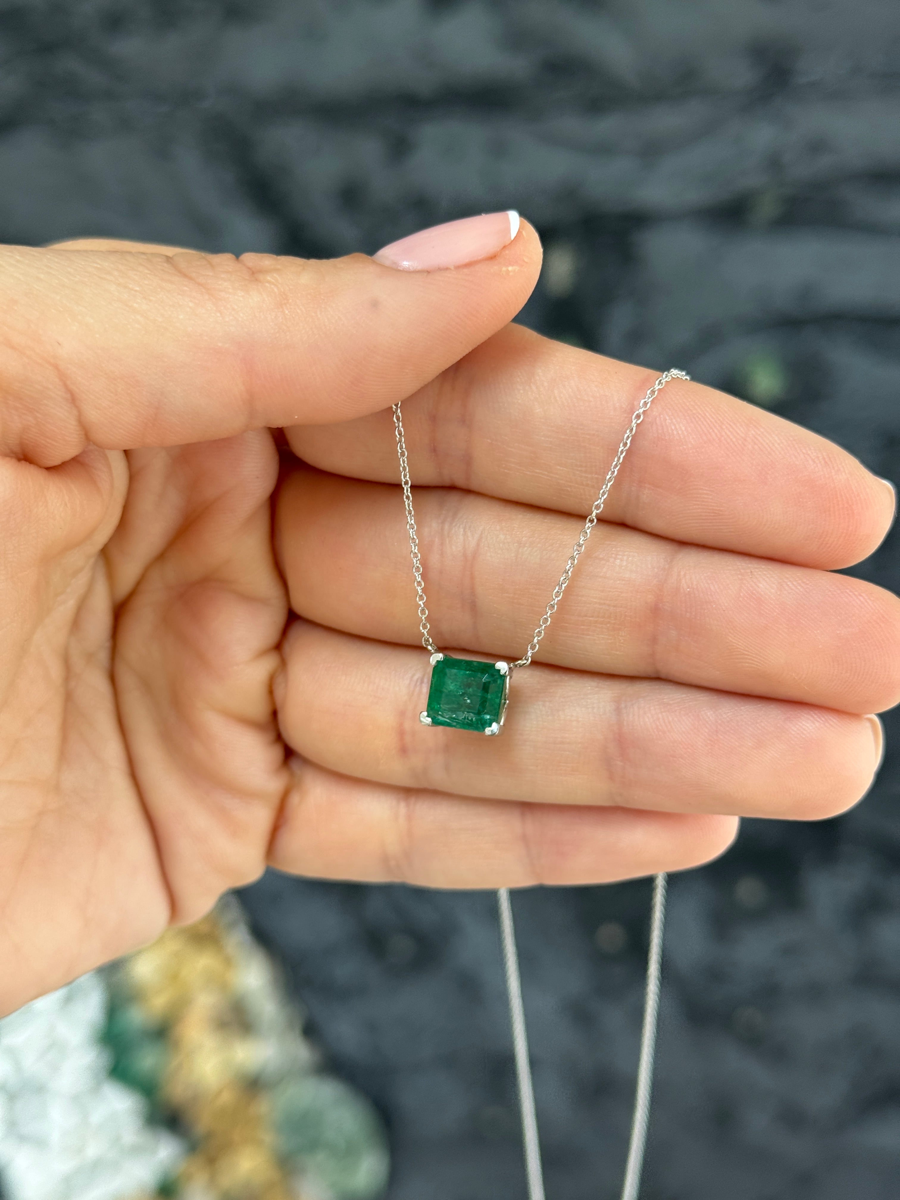 18K white gold emerald solitaire necklace with a 2.99-carat natural green emerald, featuring a sleek and elegant design.