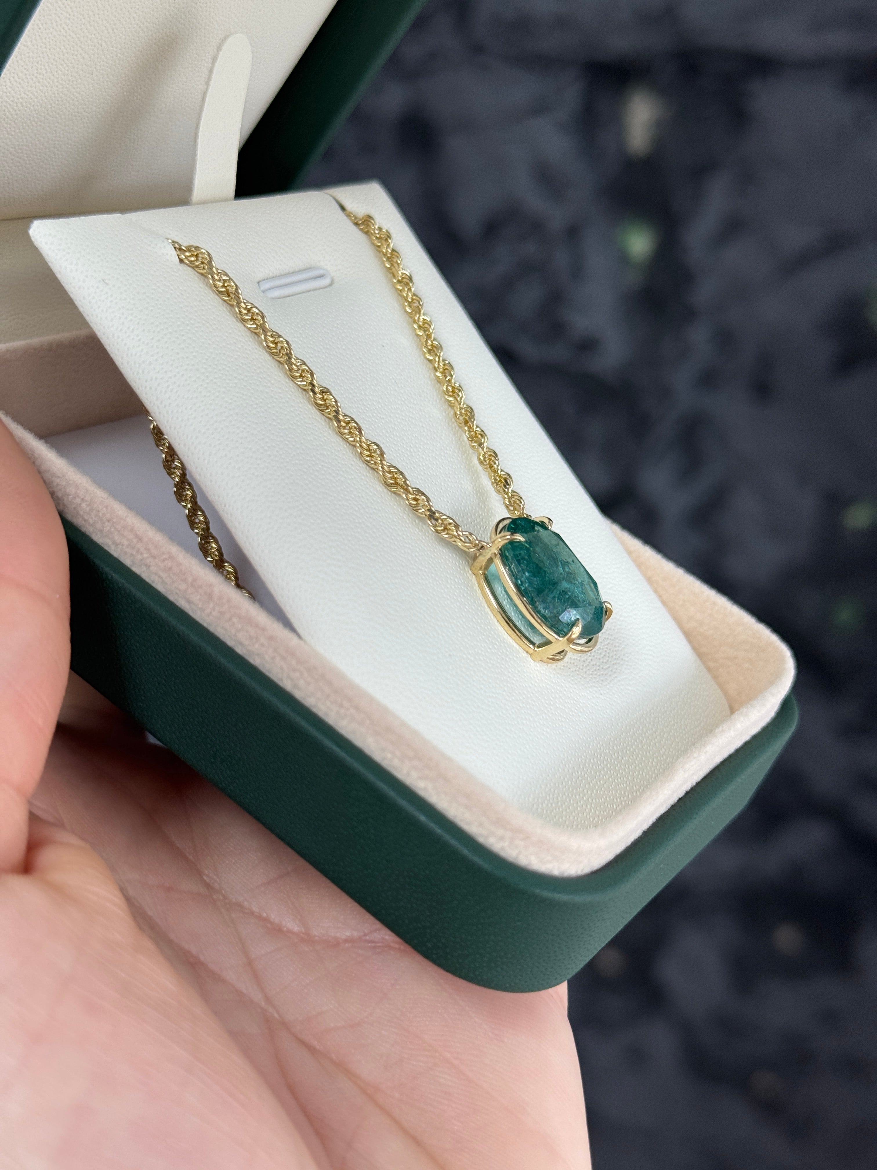 9 carat oval emerald solitaire necklace in 14K yellow gold, featuring a stunning green emerald pendant from JR Colombian Emeralds.