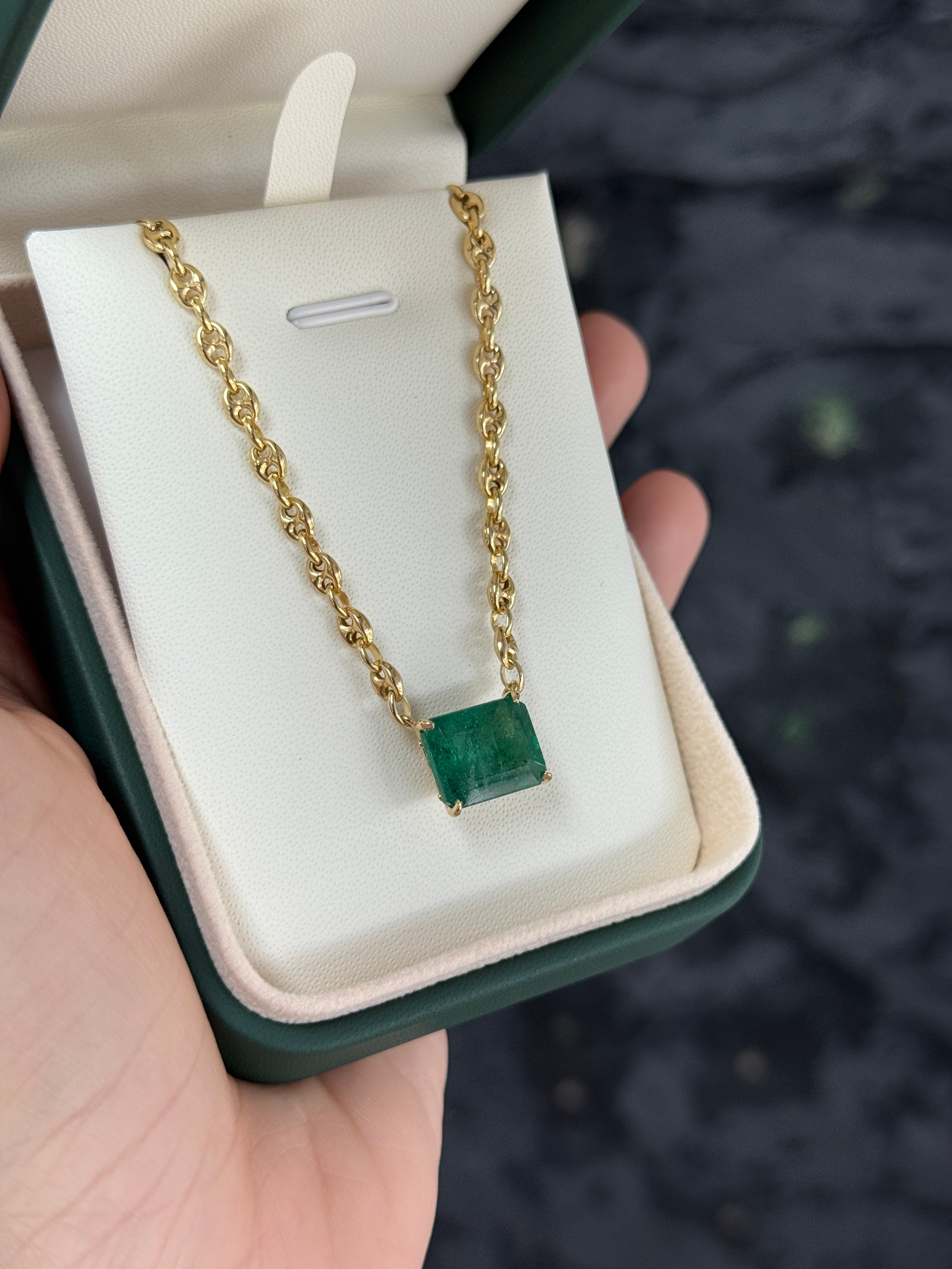 7.30 carat east to west emerald solid Gucci link necklace, 20-inch 14K gold, featuring vibrant green emeralds and intricate design.