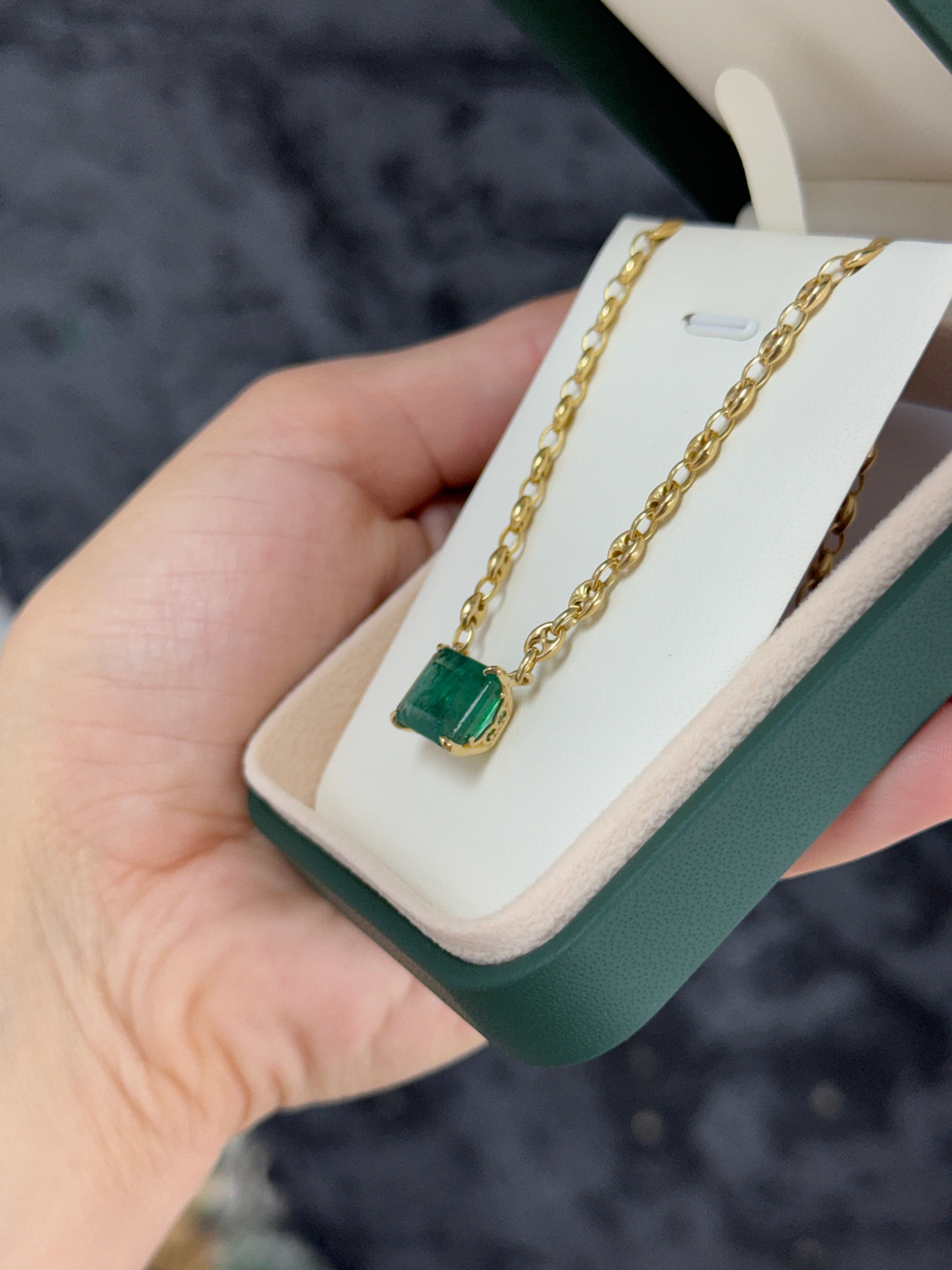 7.30 carat east-to-west emerald solid Gucci link necklace, 20-inch 14K gold, featuring vibrant green emeralds and intricate design.