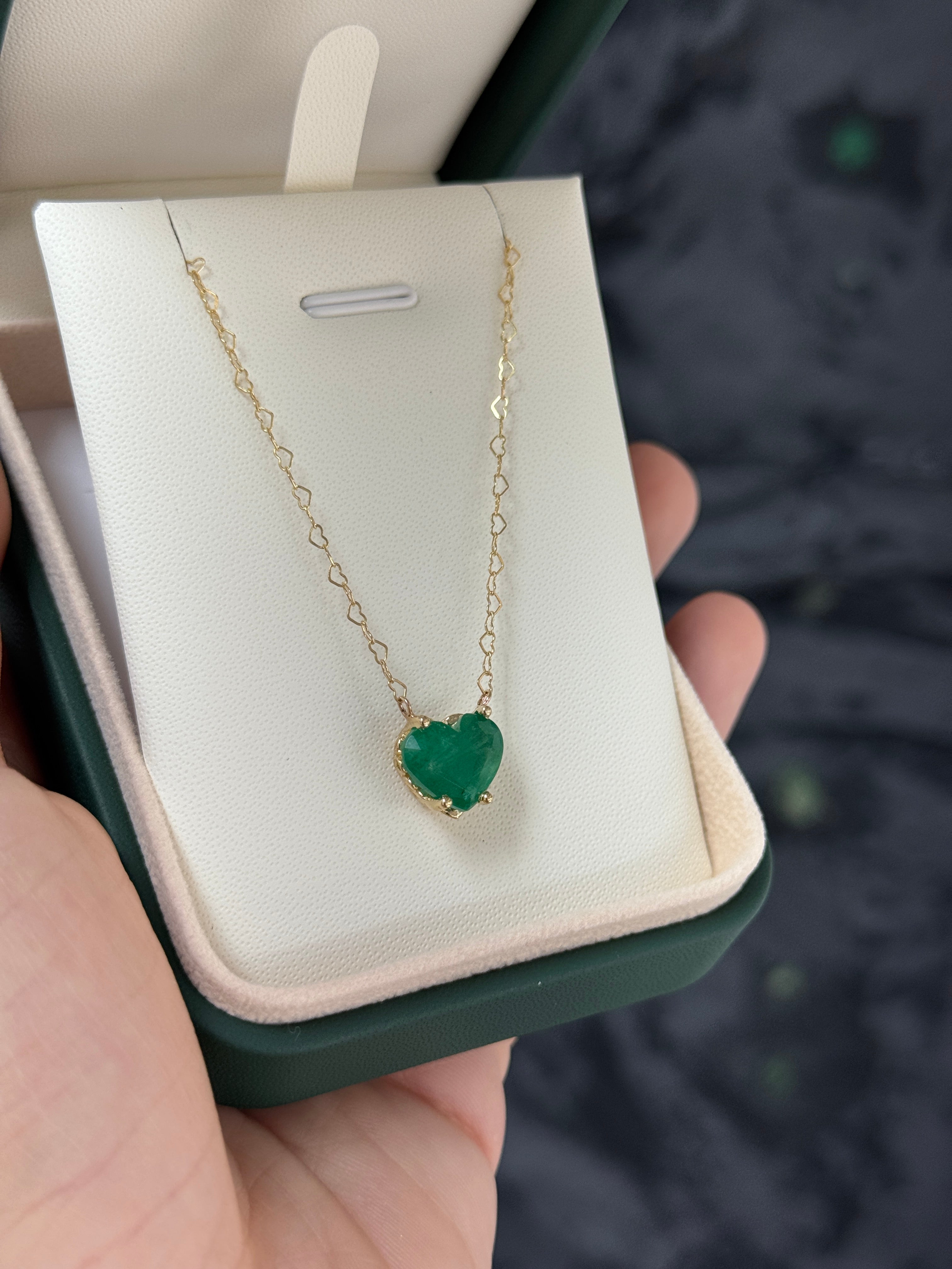 Natural Zambian emerald heart pendant necklace with solitaire setting, created by JR Colombian Emeralds.