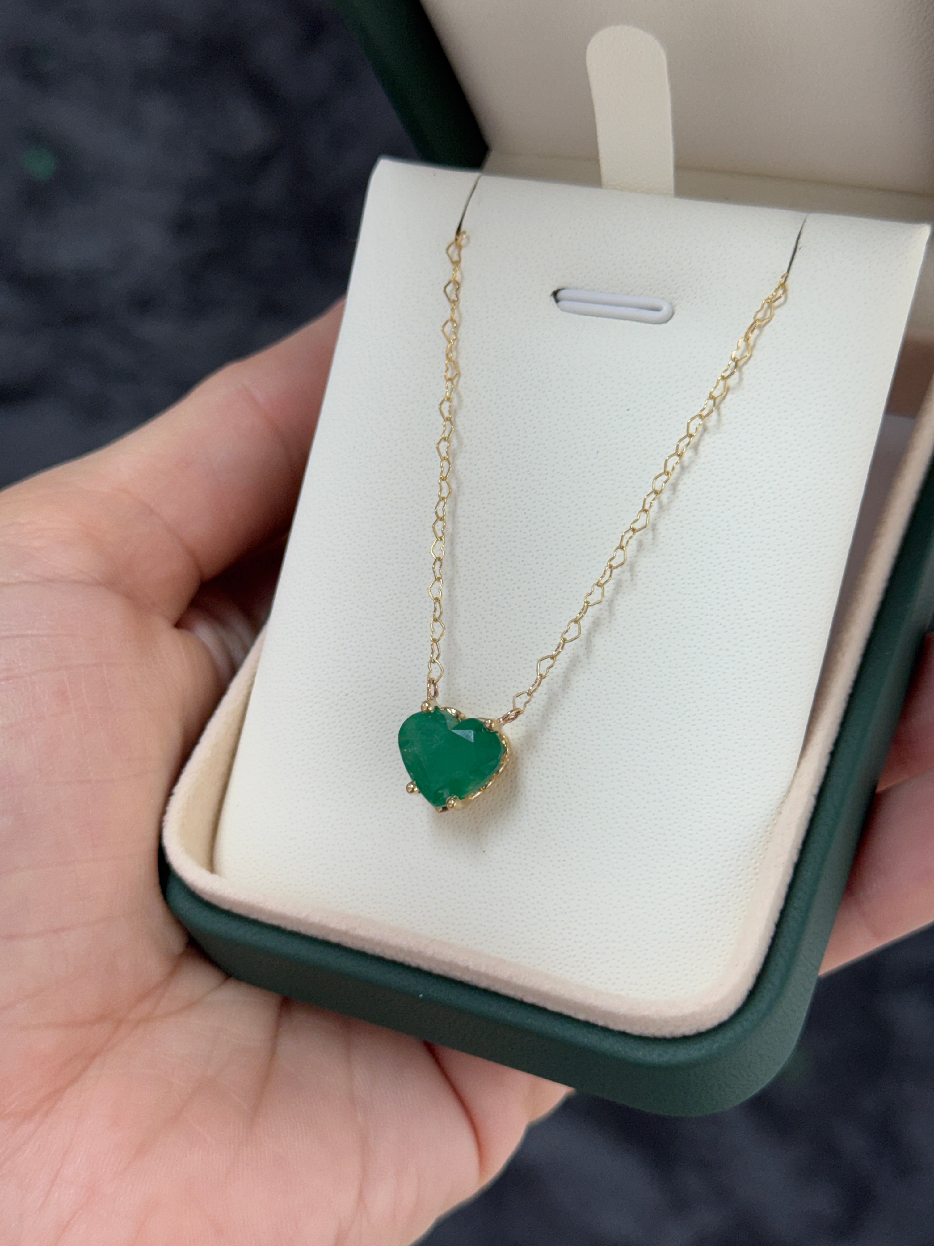 Natural Zambian emerald heart-shaped solitaire necklace with a silver chain, featuring a 4.07-carat emerald from JR Colombian Emeralds.