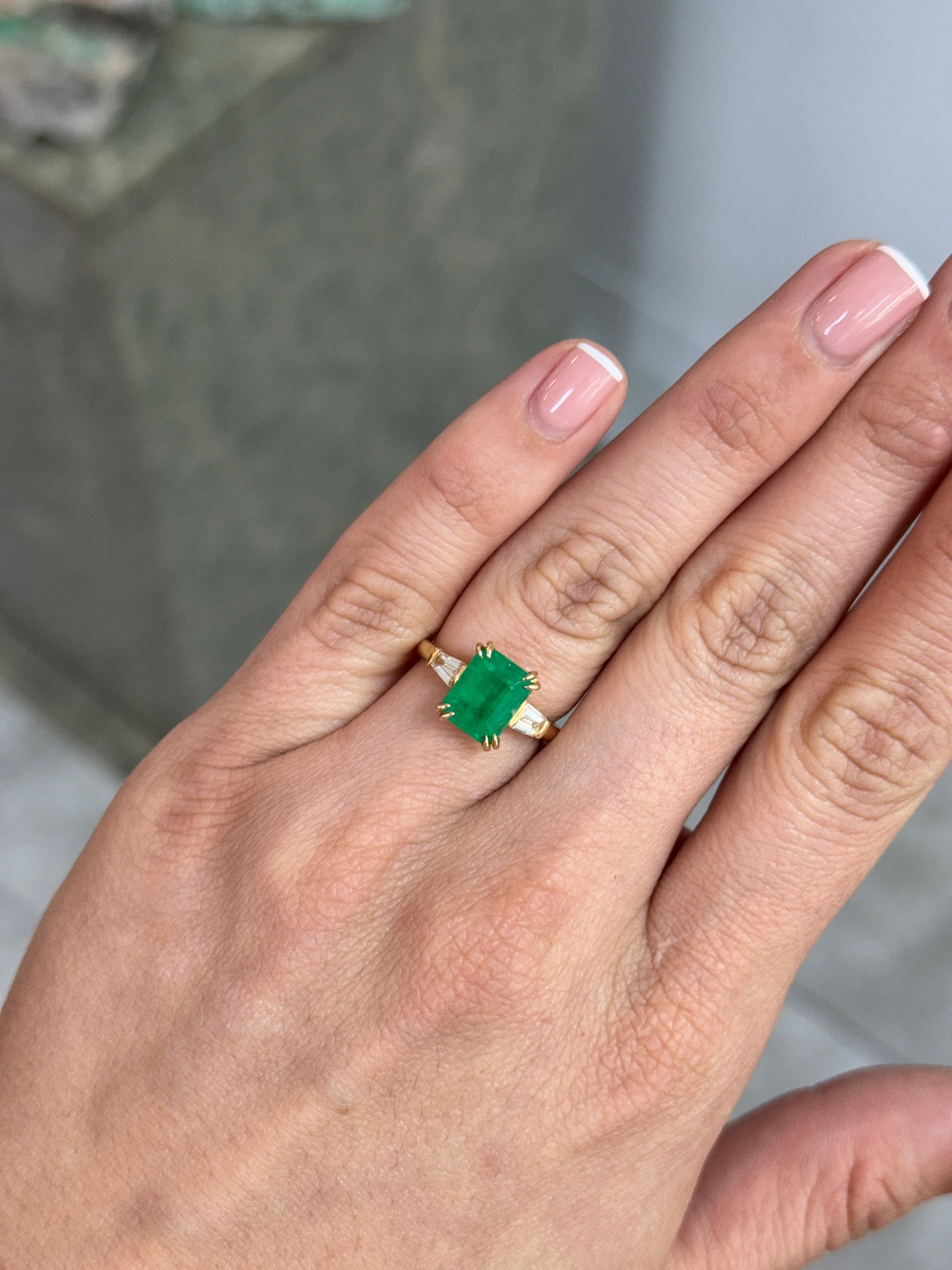 18K Colombian emerald and tapered baguette diamond ring featuring 3.36 carats, designed by JR Colombian Emeralds.