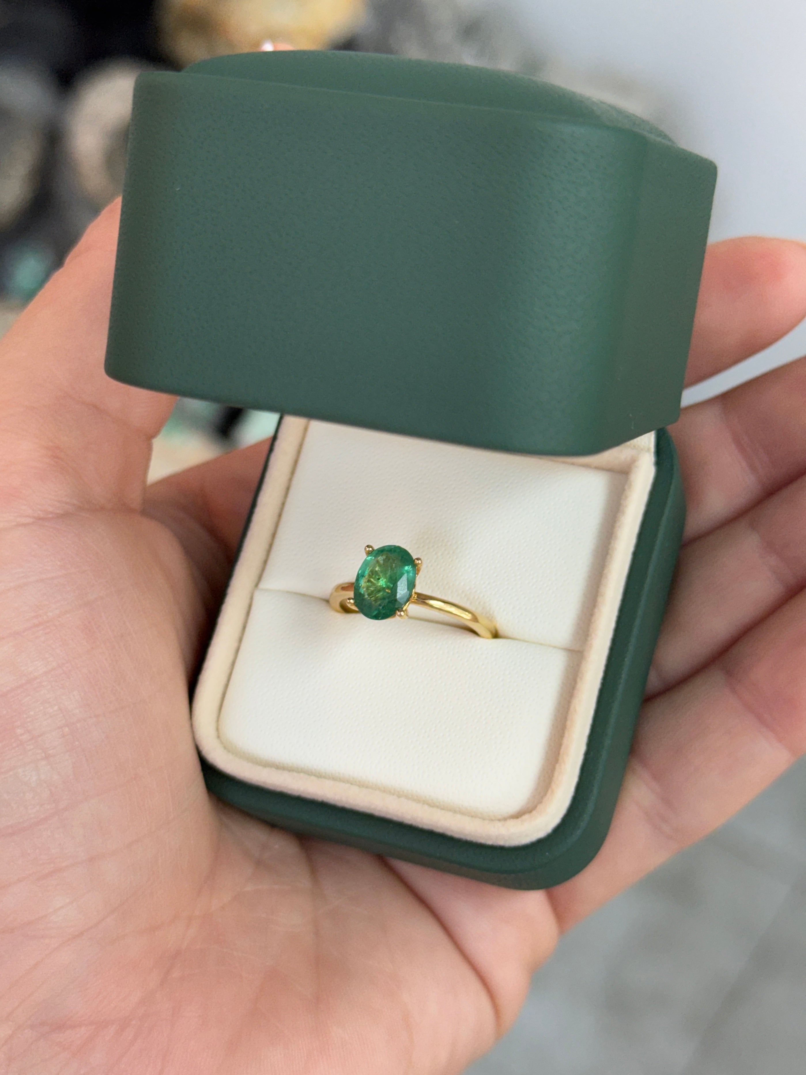 Natural 1.43 carat emerald oval cut solitaire engagement ring in 18K gold by JR Colombian Emeralds, with four-prong setting.