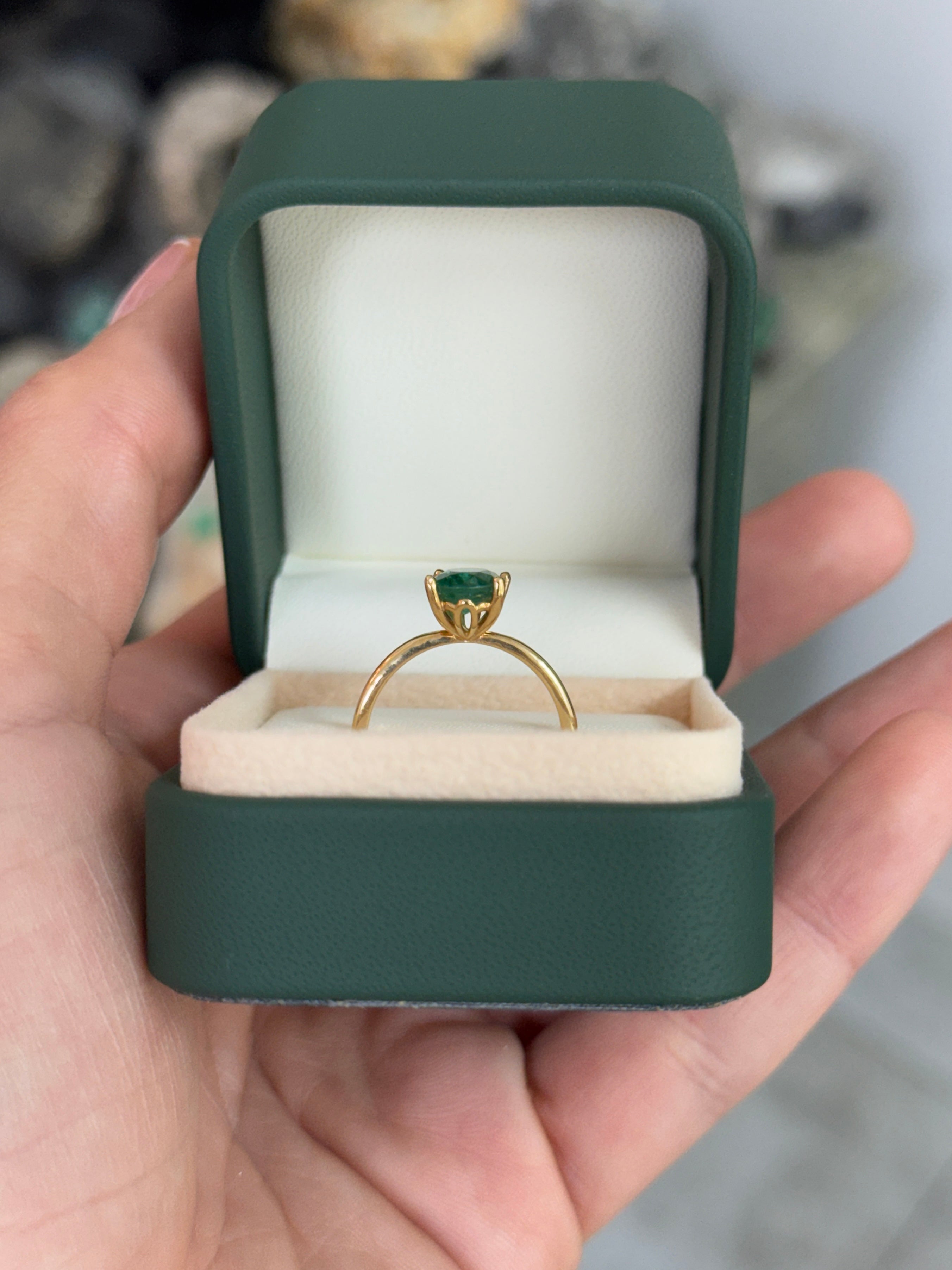 Natural 1.43 carat emerald solitaire engagement ring with oval cut, four prongs, 18K gold from JR Colombian Emeralds.