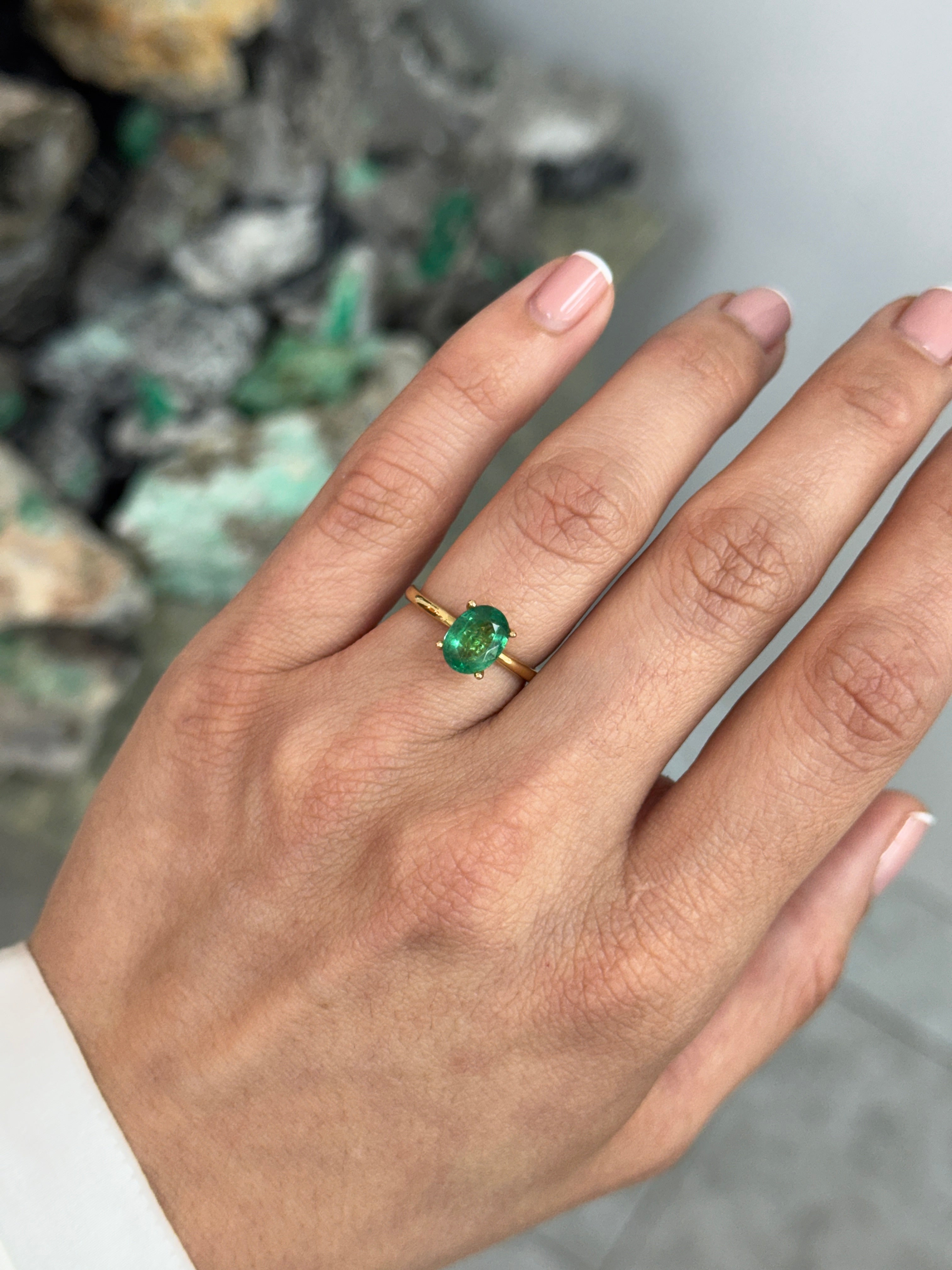 Natural 1.43 Carat emerald oval cut solitaire engagement ring with 18K gold four-prong setting by JR Colombian Emeralds.