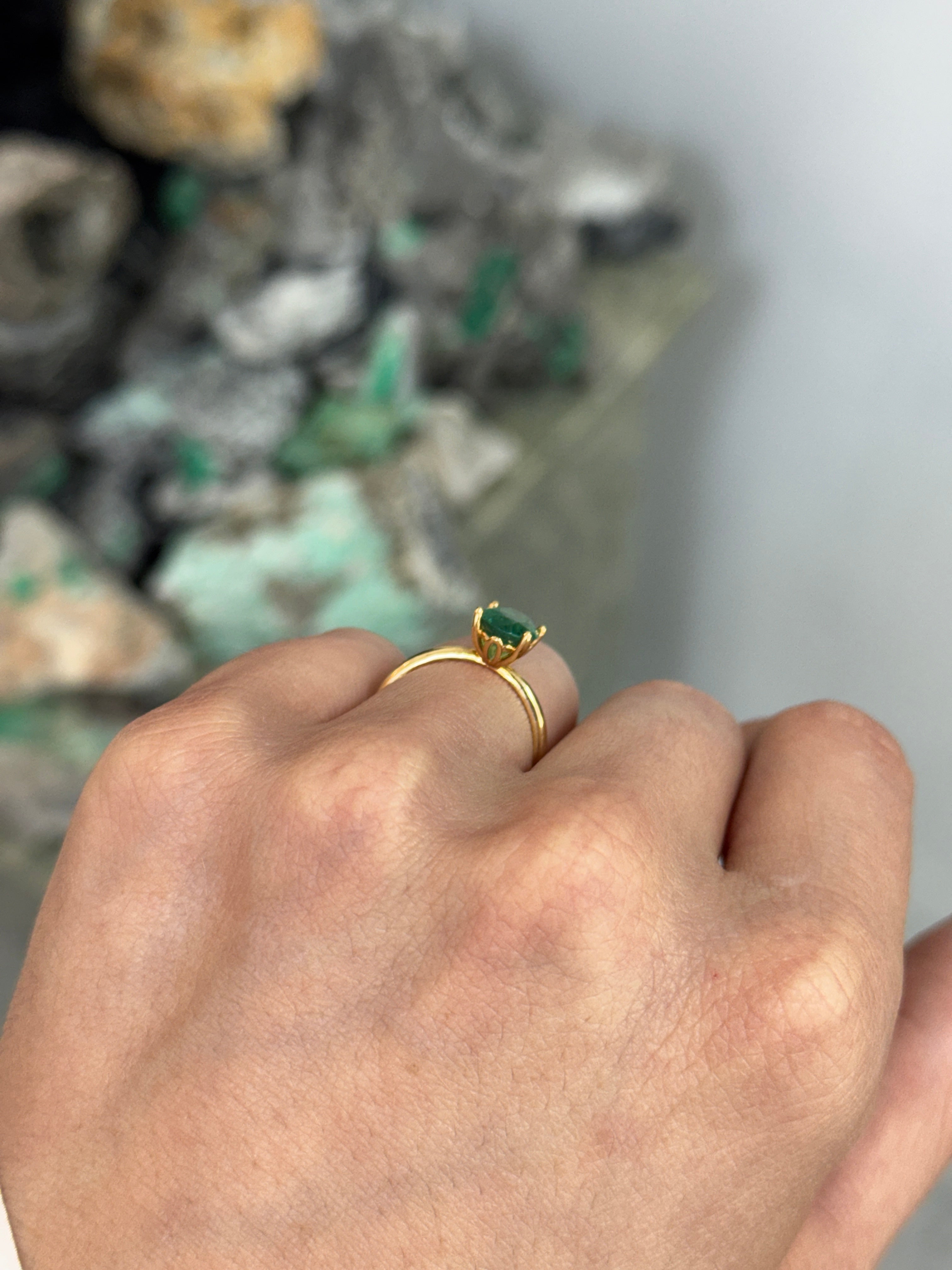 Oval cut 1.43 carat natural emerald solitaire engagement ring in 18K gold with four prongs, by JR Colombian Emeralds.