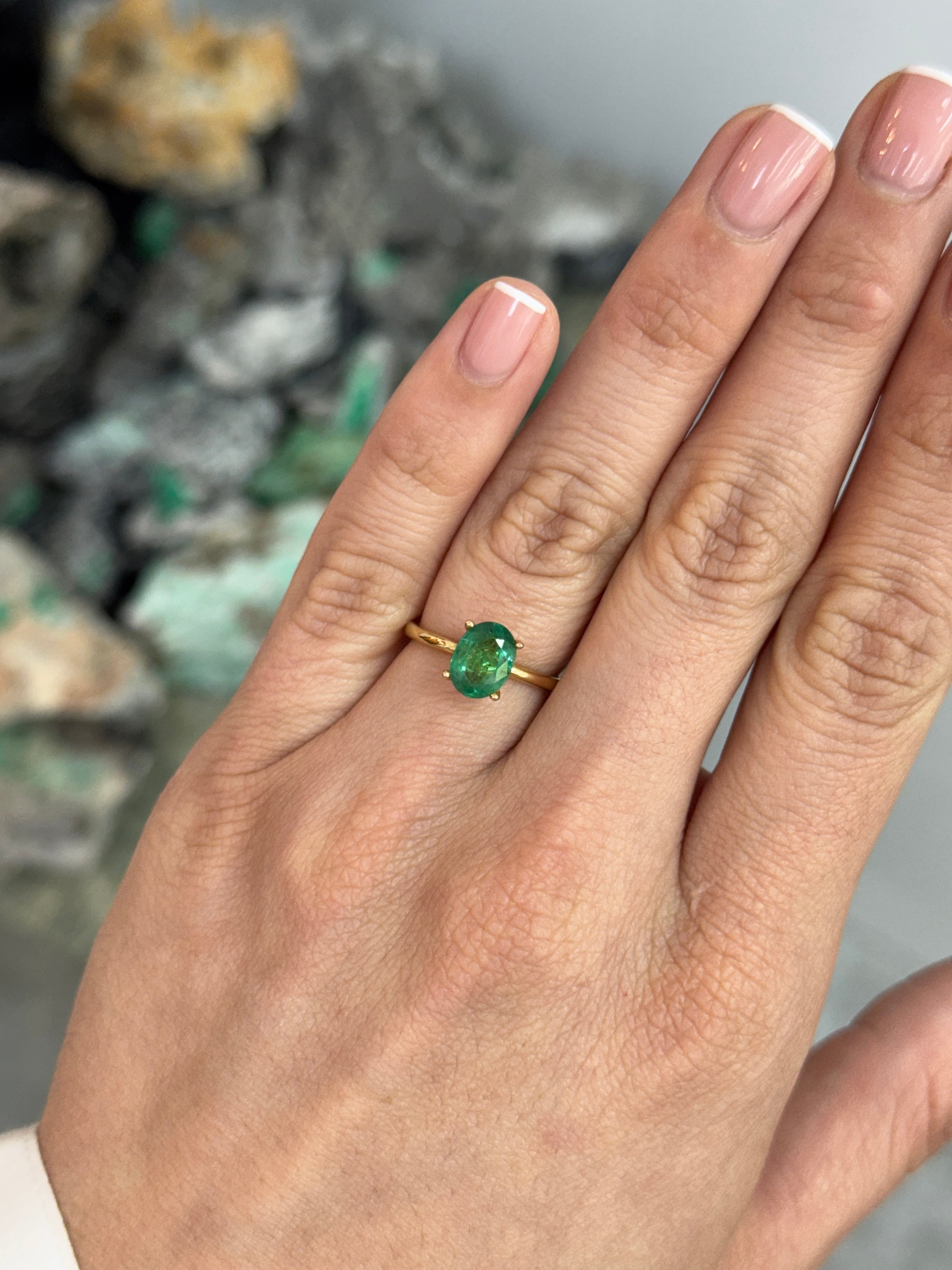 Natural 1.43 carat emerald oval cut solitaire engagement ring in 18K gold with four prongs by JR Colombian Emeralds.