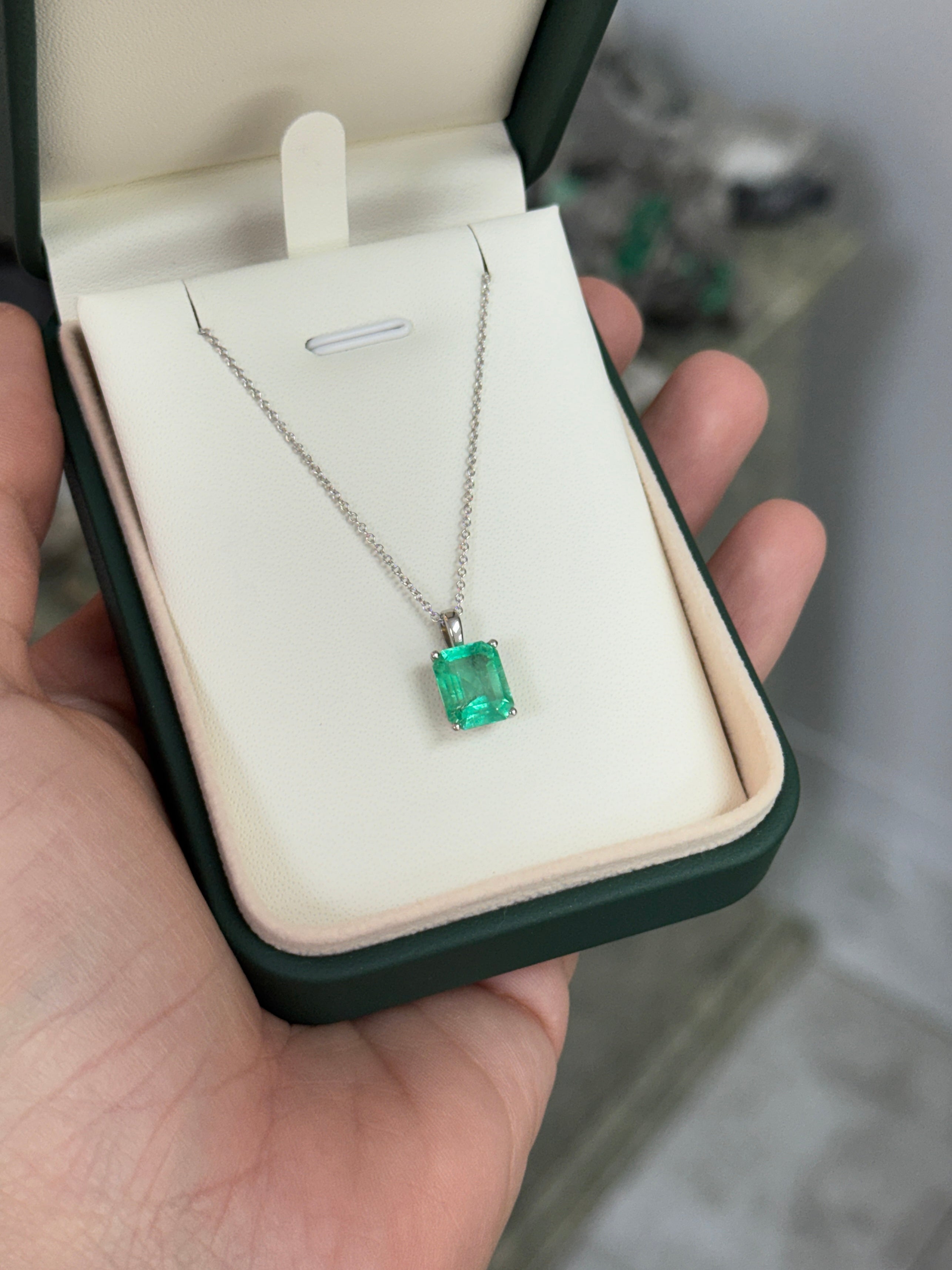 14K white gold Colombian emerald solitaire necklace featuring a 2.51 carat vibrant green emerald.