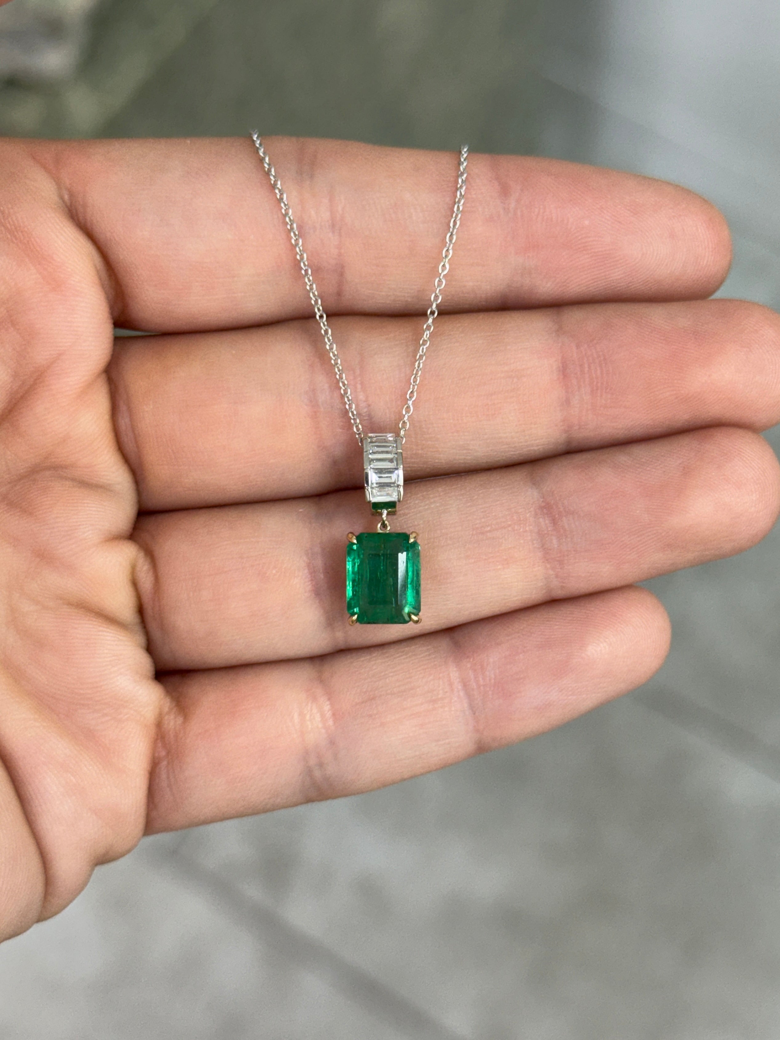 Natural emerald and lab diamond bail pendant with 3.57 carats, set in 14K gold, featuring classic emerald and baguette diamonds.