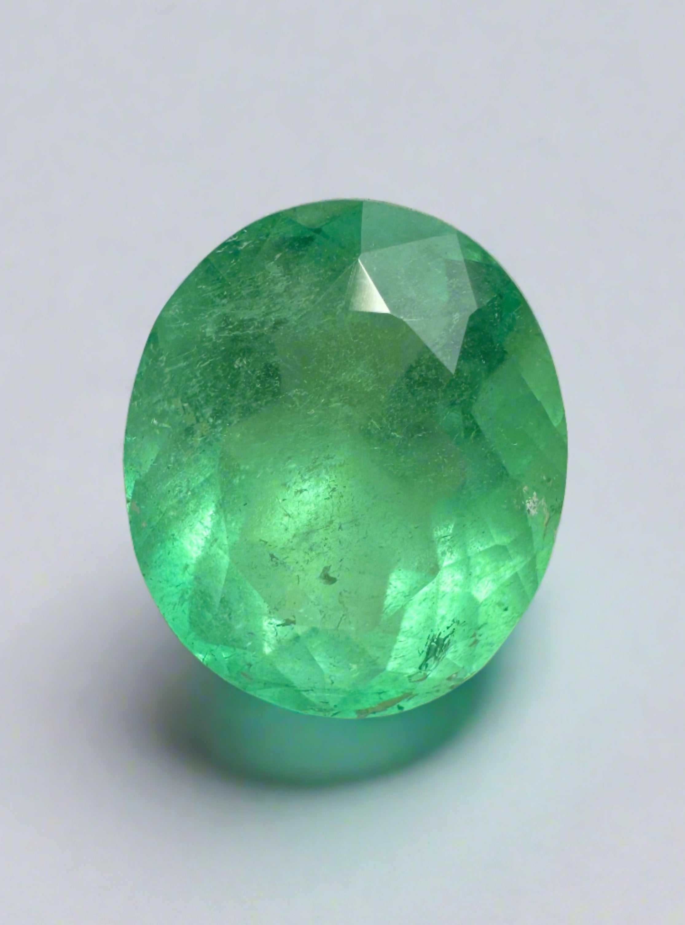 5.21 carat oval cut yellowish green natural Colombian emerald loose gemstone