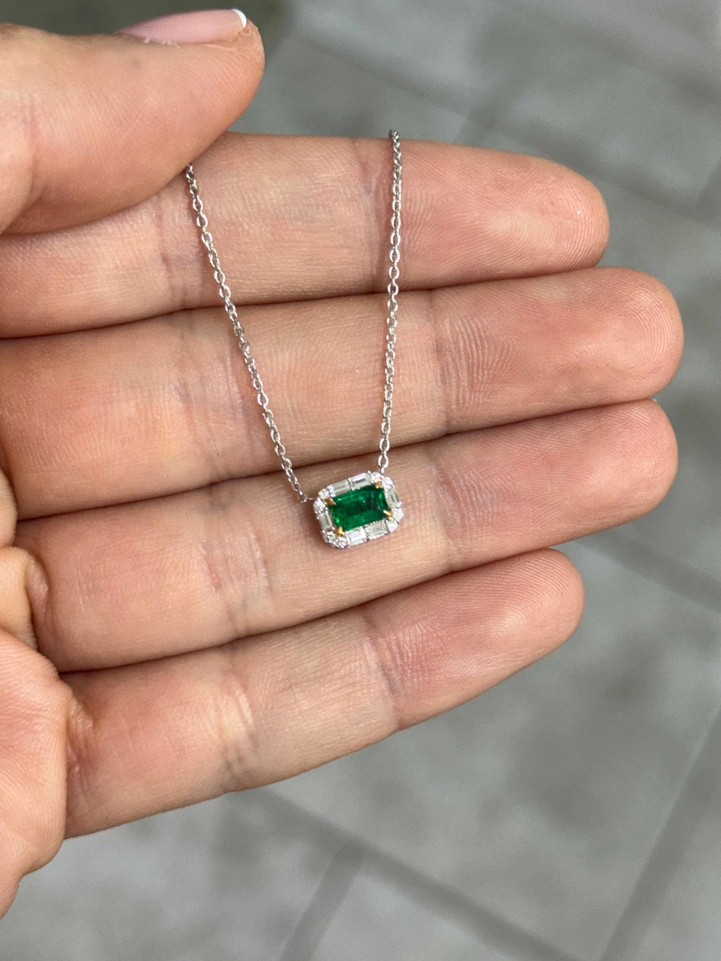 AAA+ natural emerald and baguette diamond halo necklace in 18K gold featuring east-to-west station design by JR Colombian Emeralds