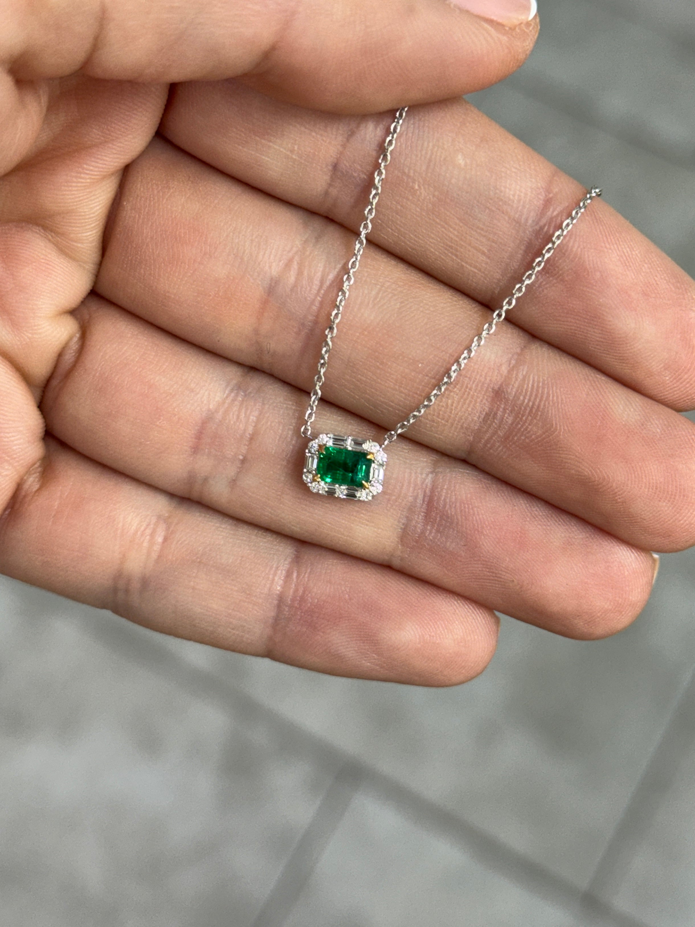 AAA+ natural emerald and baguette diamond halo necklace by JR Colombian Emeralds, with east-west station design on 18K gold.