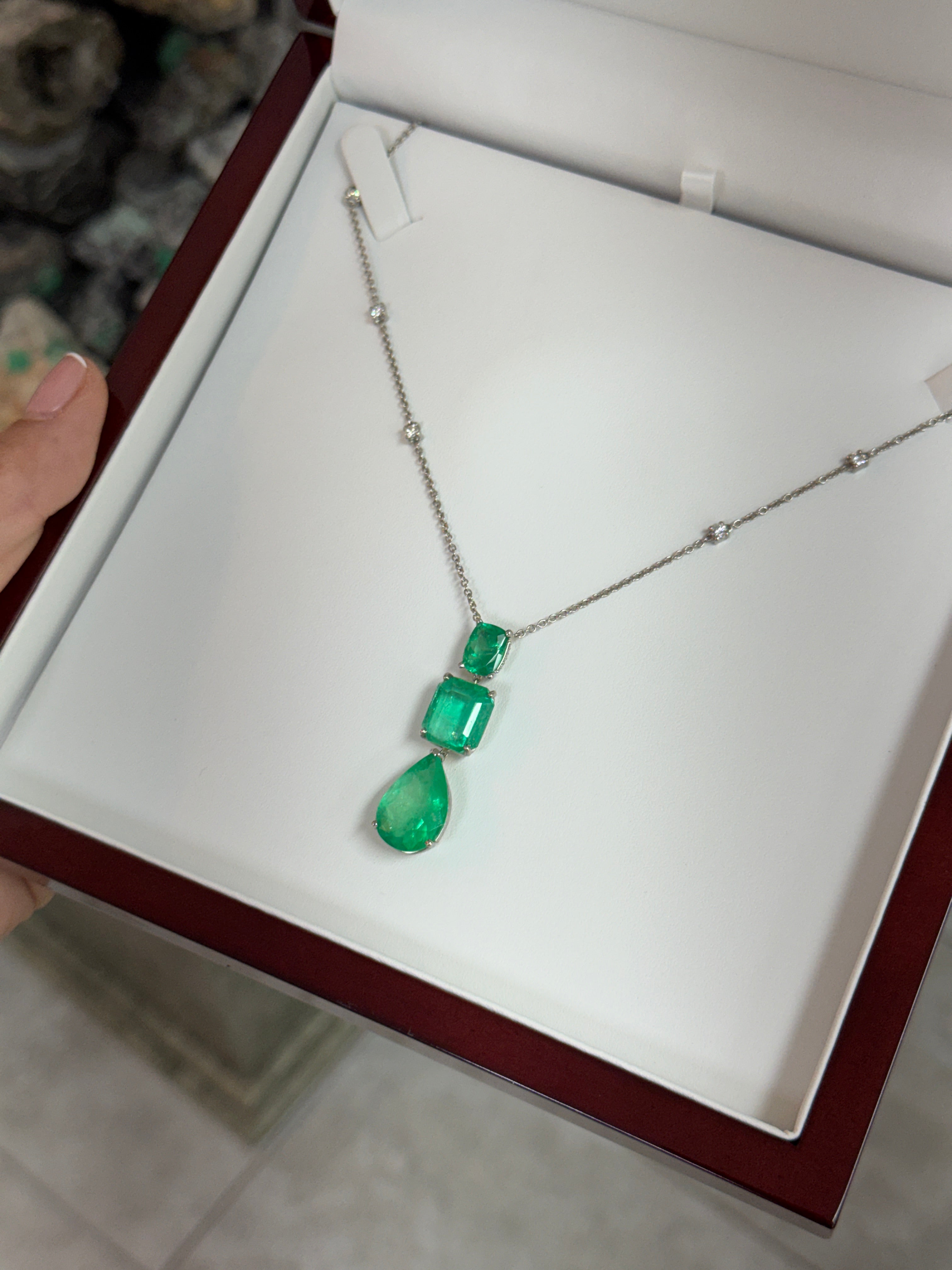 Colombian emerald and diamond by the yard necklace with cushion and pear-shaped emerald cuts in platinum, featuring 21.29 carats.
