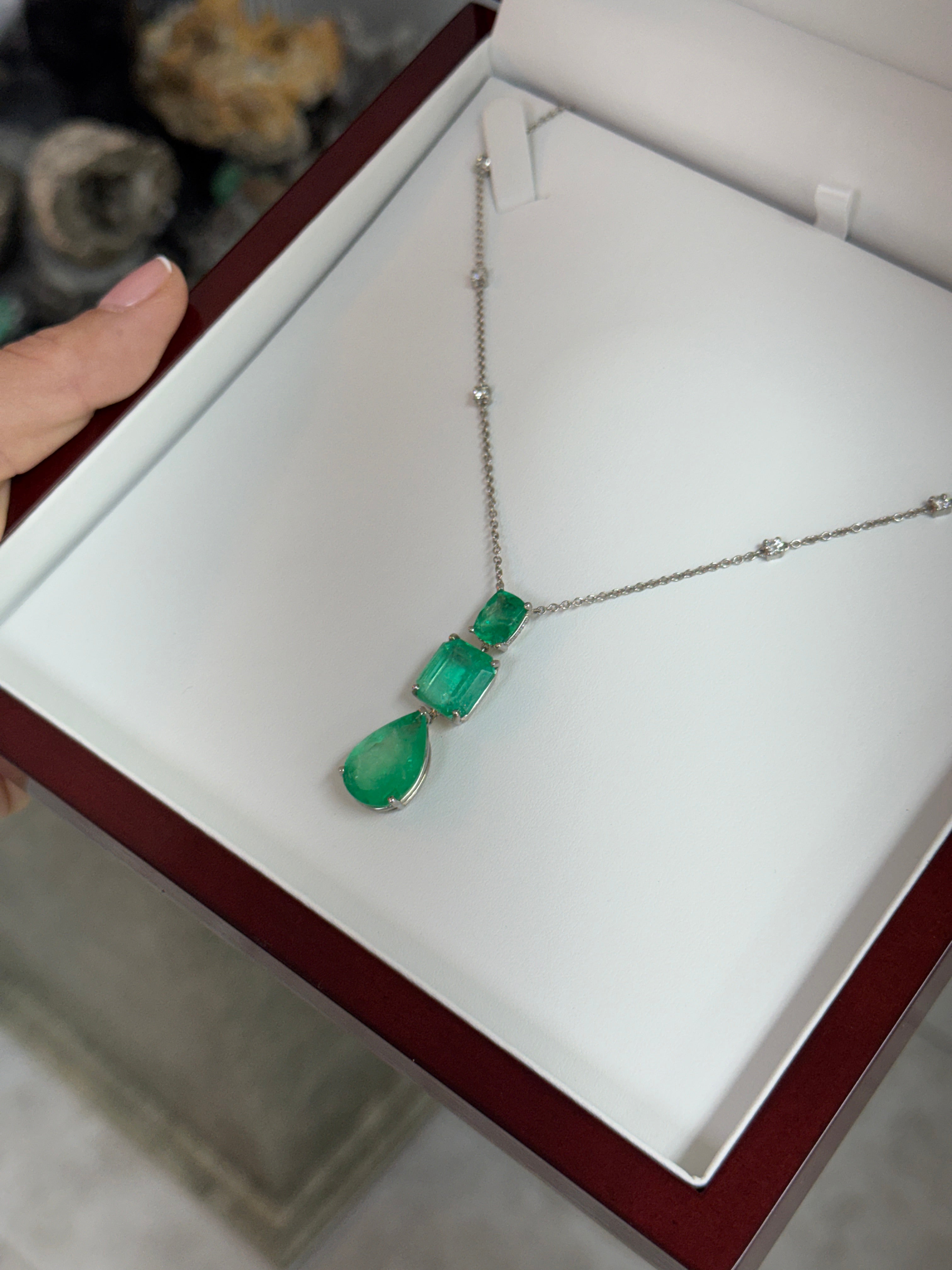Colombian emerald and diamond by the yard necklace featuring cushion and pear-shaped emerald cuts in platinum, crafted by JR Colombian Emeralds.