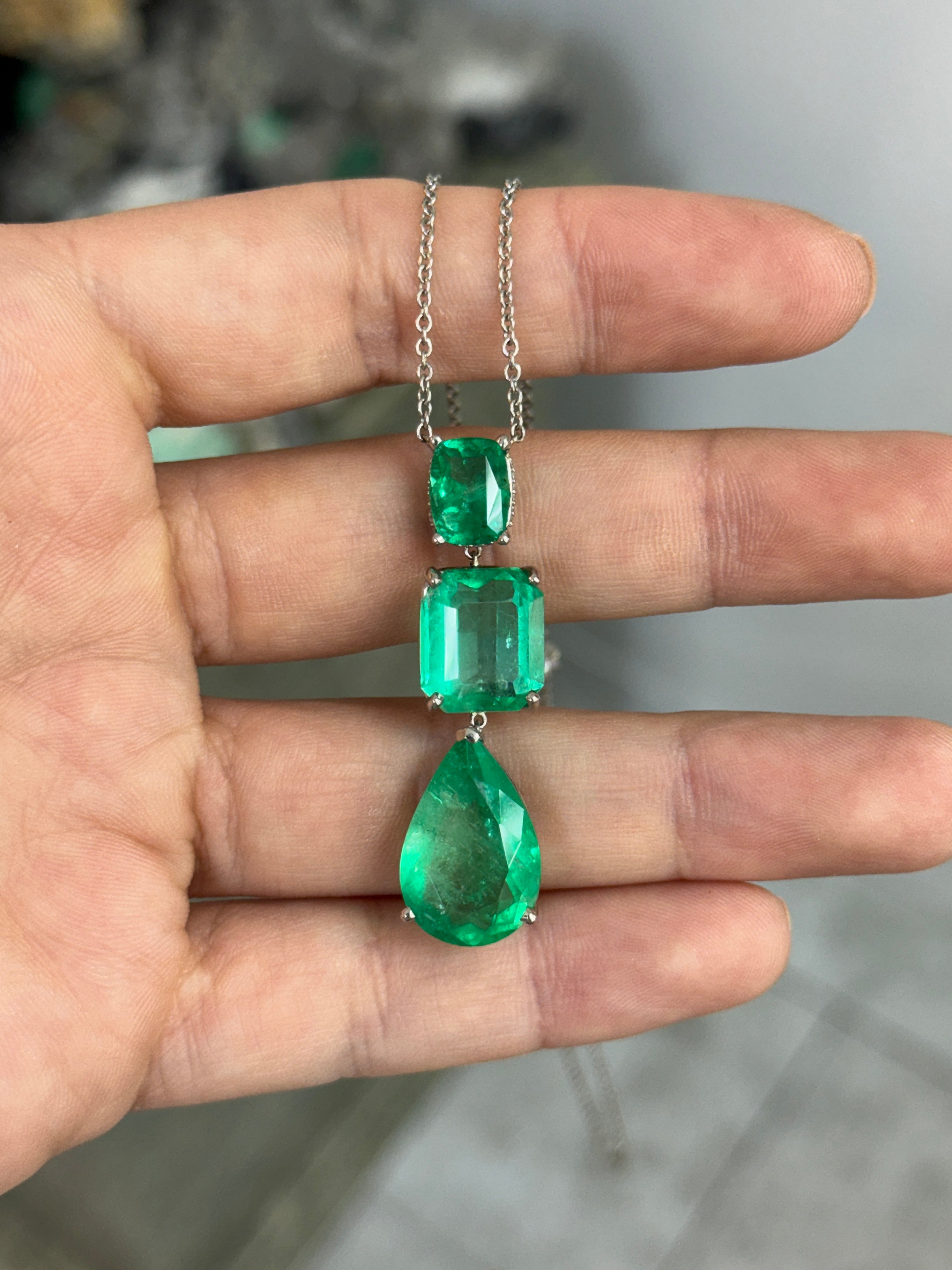 Colombian emerald diamond by the yard necklace featuring cushion and pear cut emeralds with platinum setting, crafted by JR Colombian Emeralds.