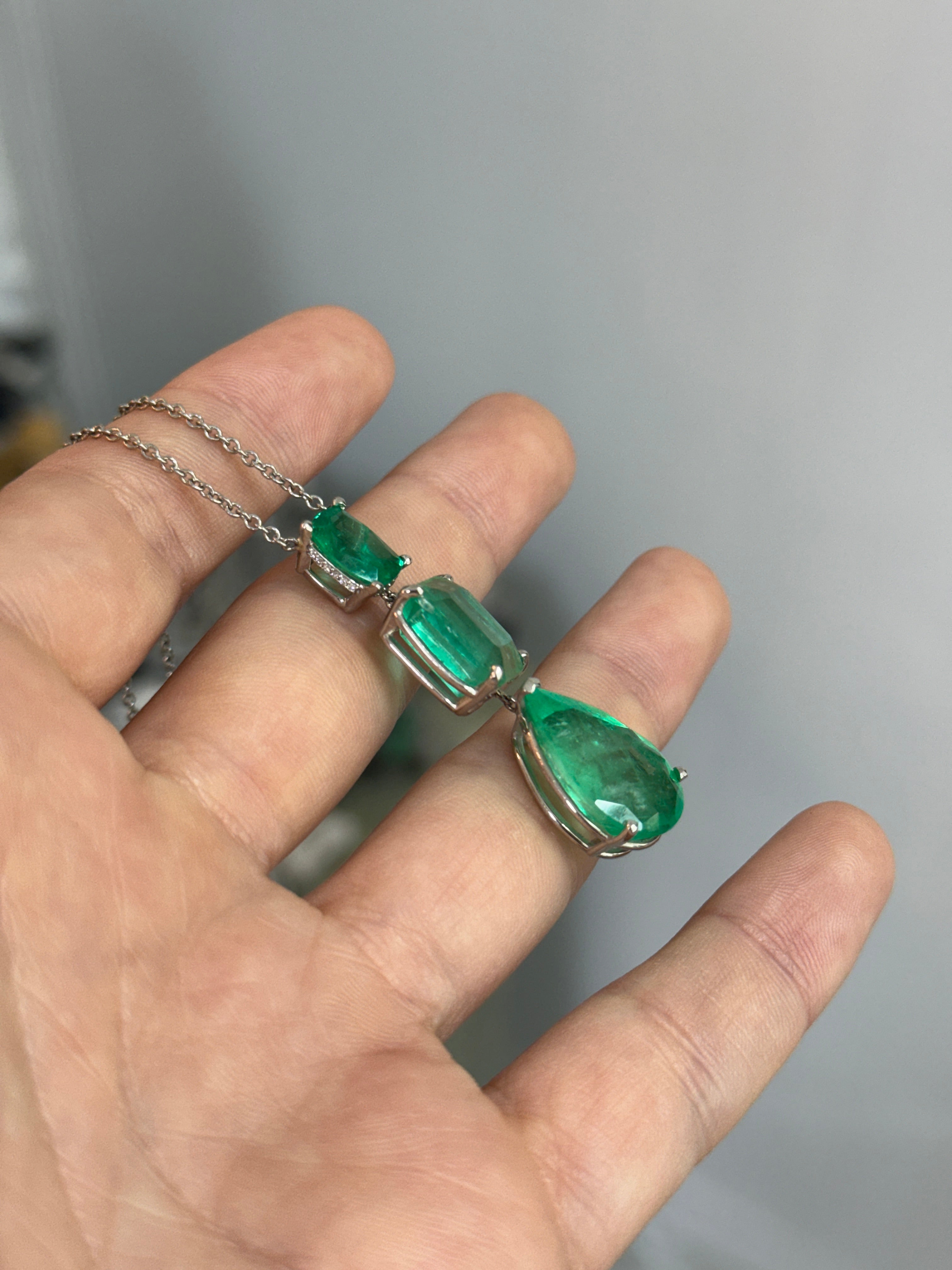 Colombian emerald and diamond by the yard necklace with cushion and pear drop emerald cuts in platinum, featuring 21.29 tcw gemstones.