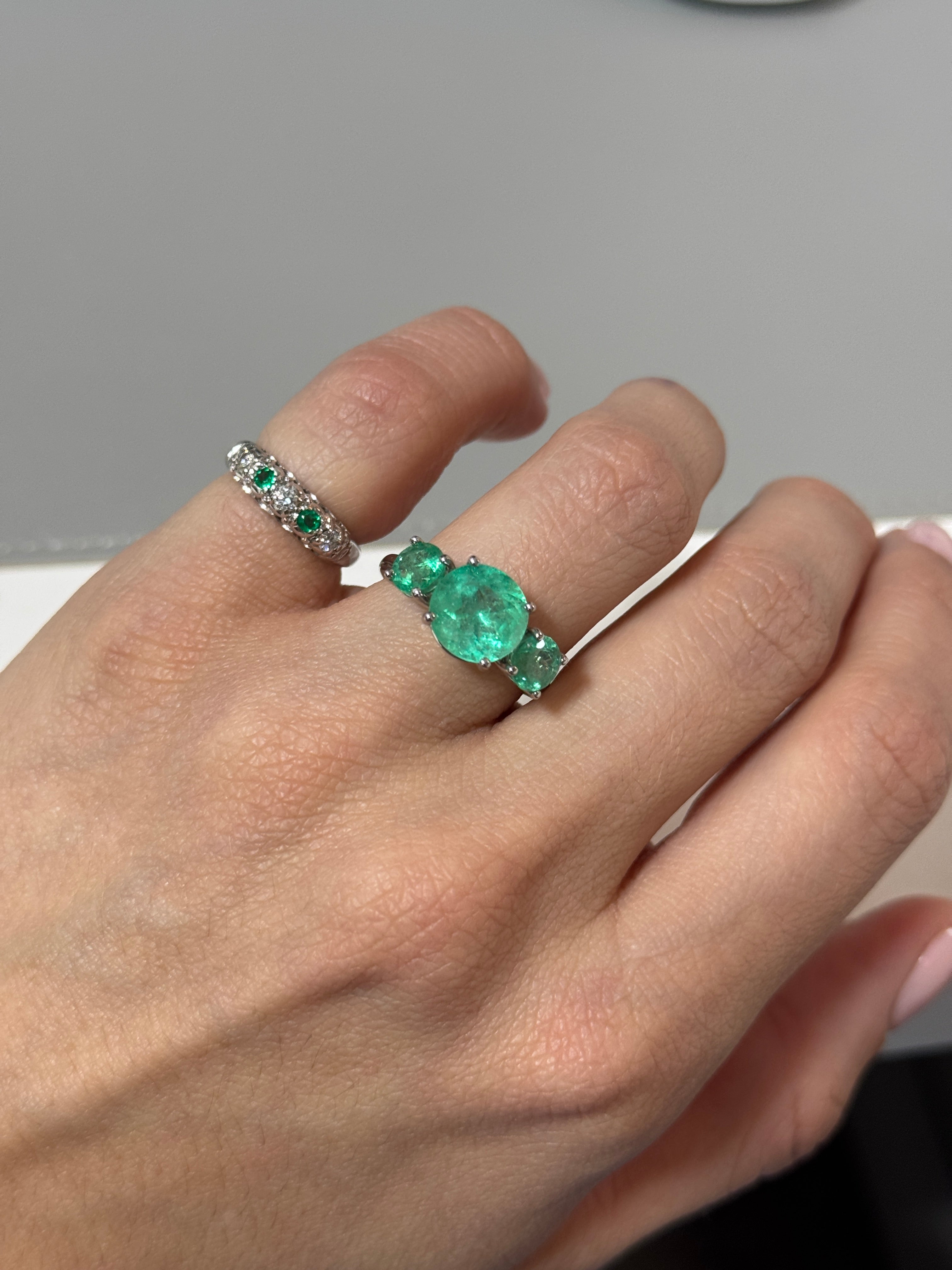 Myra J. Colombian Emerald and diamond pinky ring by JR Colombian Emeralds, featuring vibrant green emeralds and sparkling diamonds.