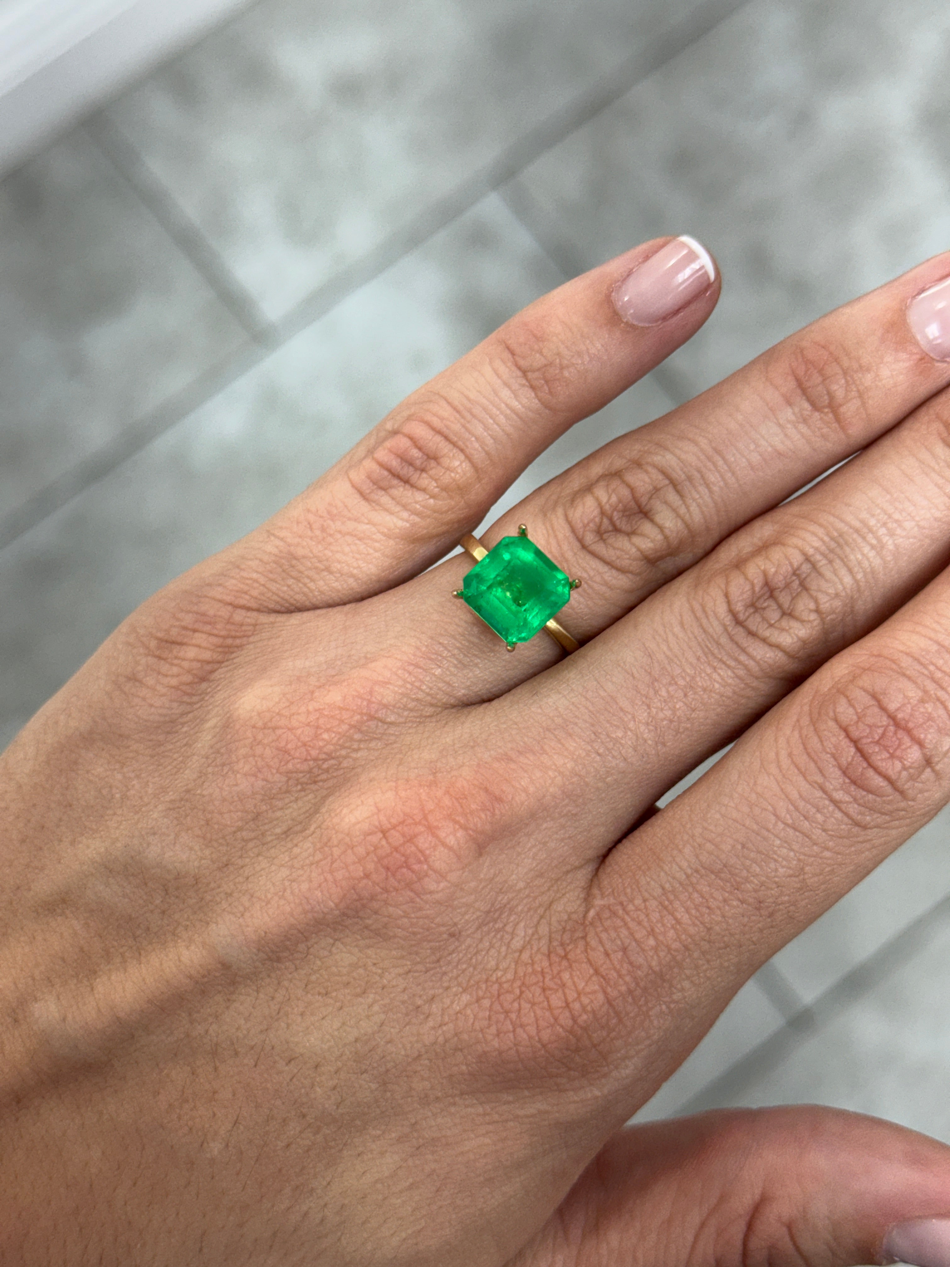 4.35 carat 10x10 mm Colombian emerald loose gemstone with Asscher cut and Kryptonite glow from JR Colombian Emeralds.