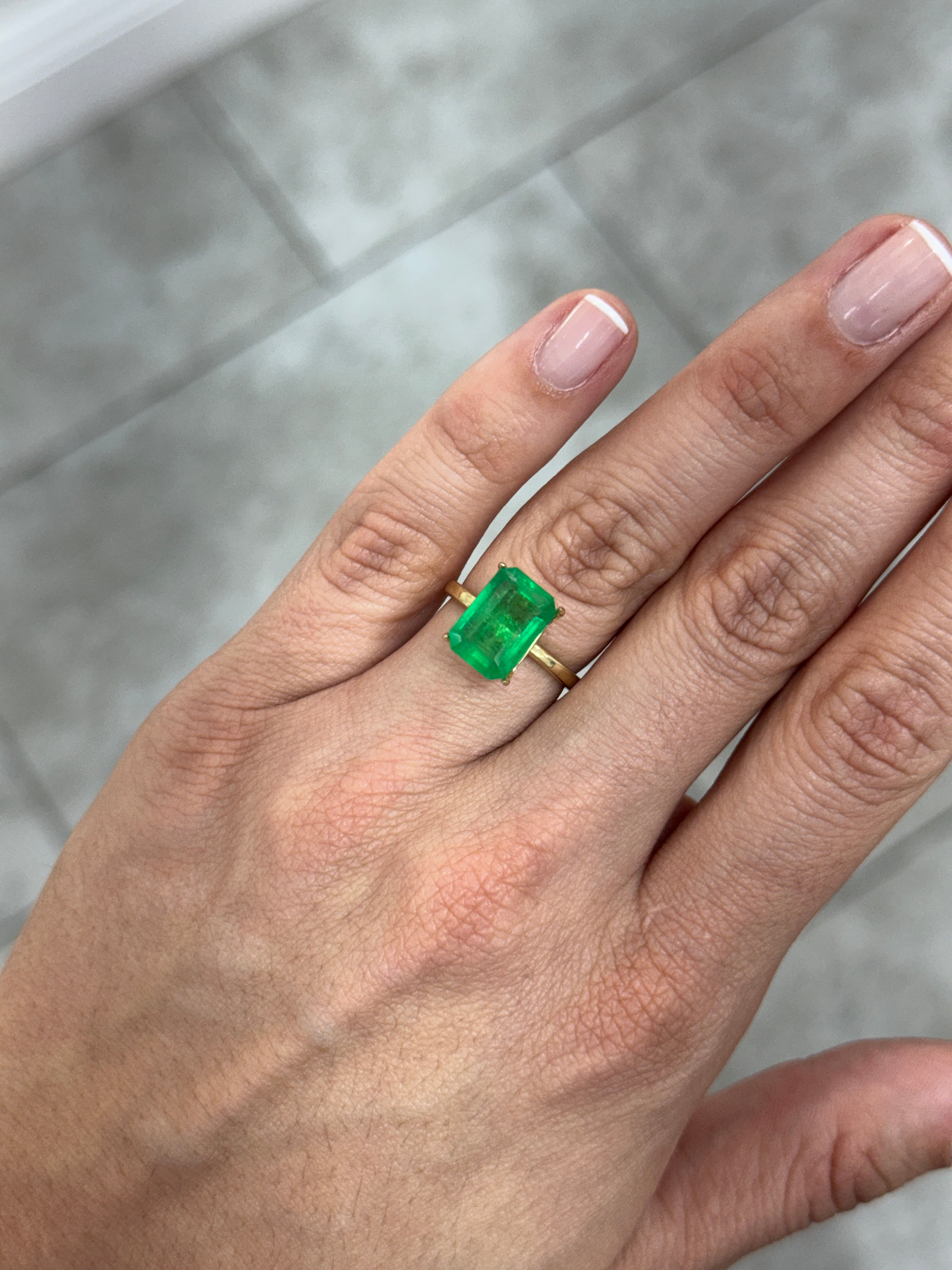 4.68 carat 12x8mm natural Colombian emerald loose gemstone with pure green color in an emerald cut by JR Colombian Emeralds