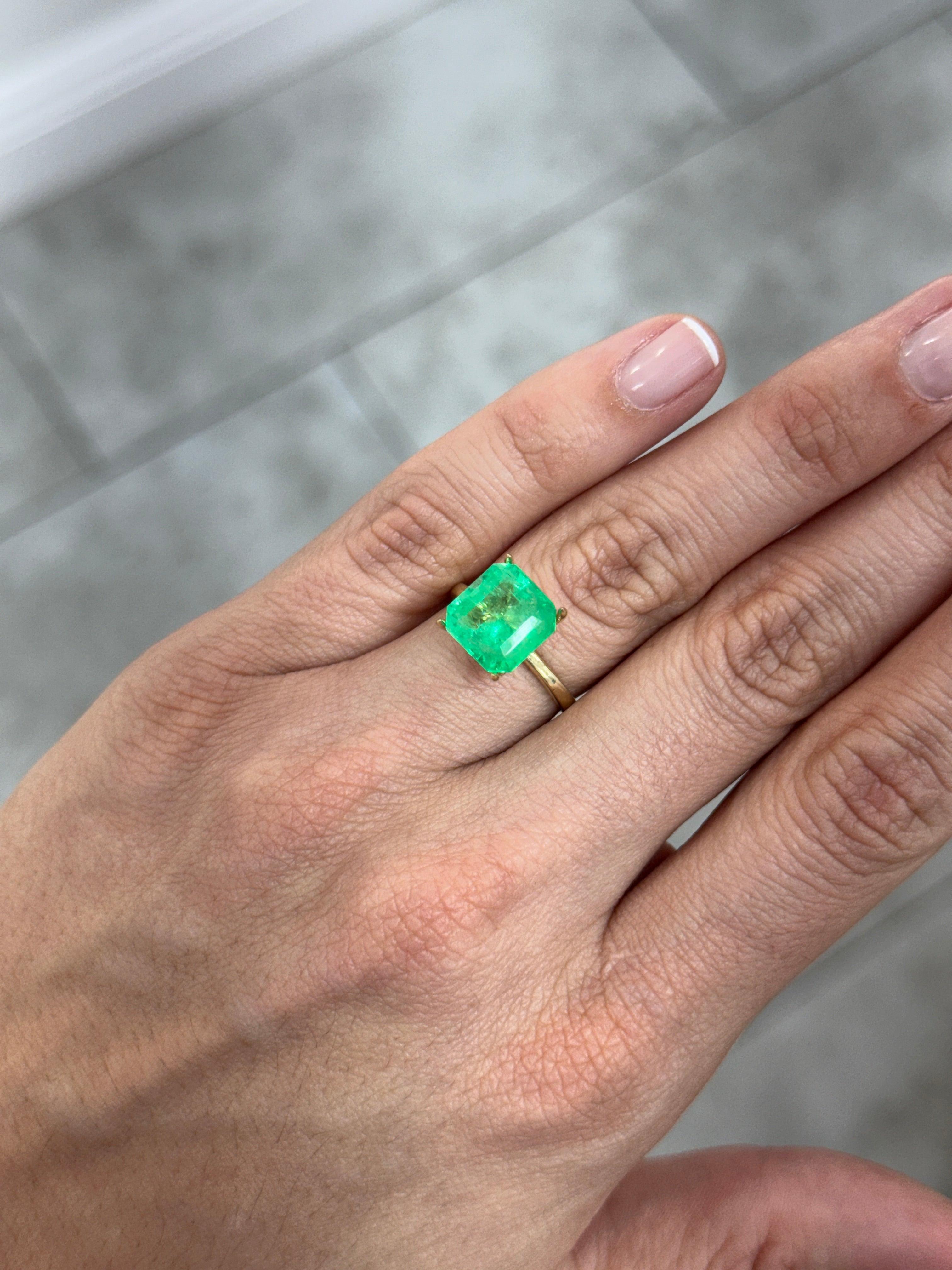 Yellowish green Colombian emerald Asscher cut with clipped corners, 4.88 carats, from JR Colombian Emeralds.
