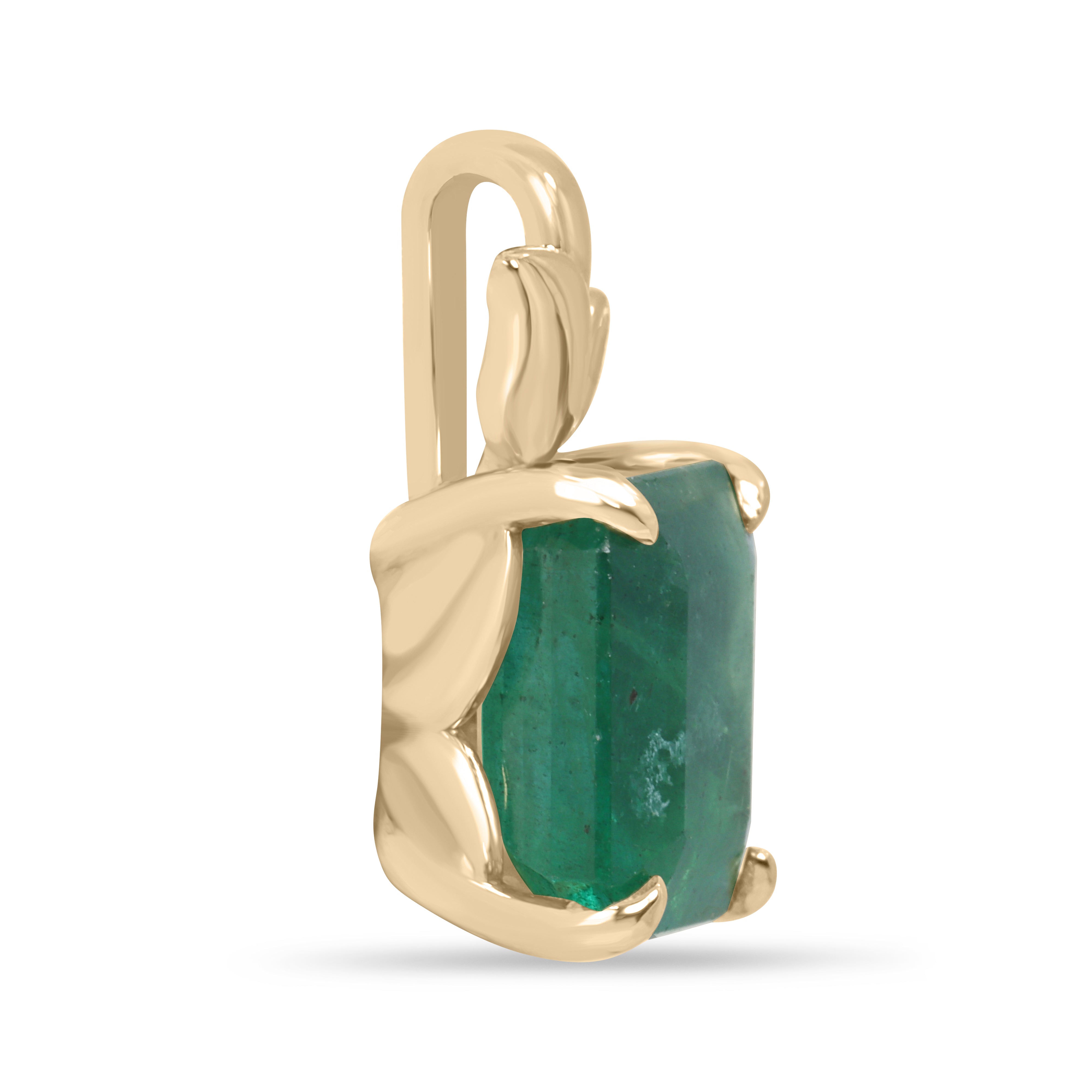 Emerald cut emerald pendant with leaf design and 14K gold bail, nature-inspired emerald necklace by JR Colombian Emeralds.