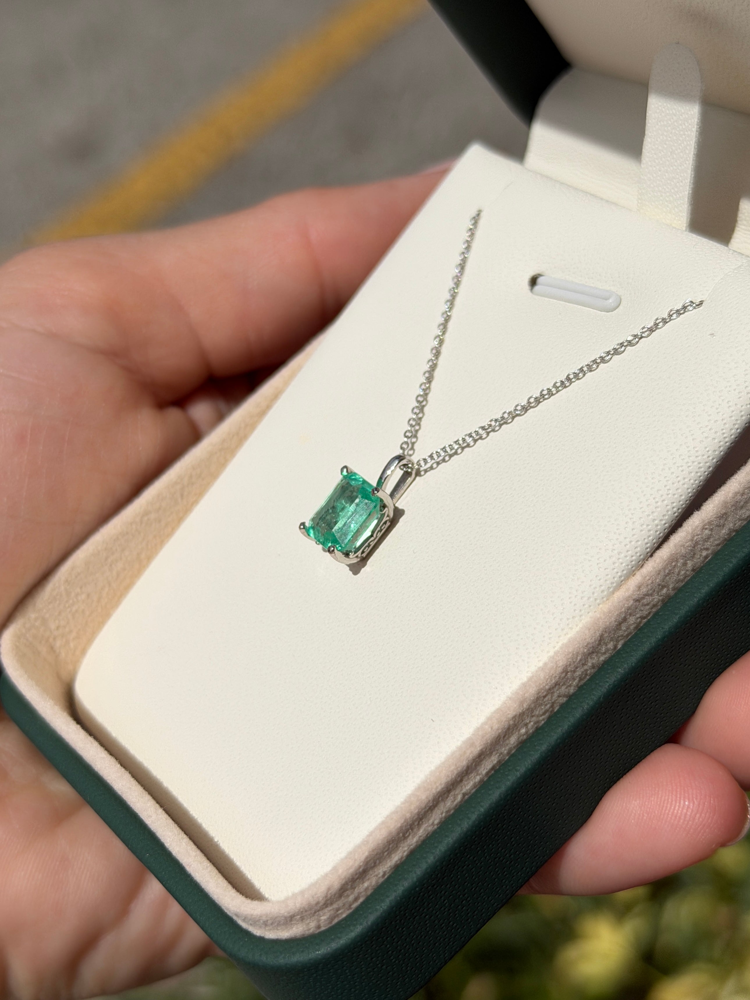 14K white gold Colombian emerald fleur de lis solitaire necklace featuring a 2.20 carat emerald from JR Colombian Emeralds.