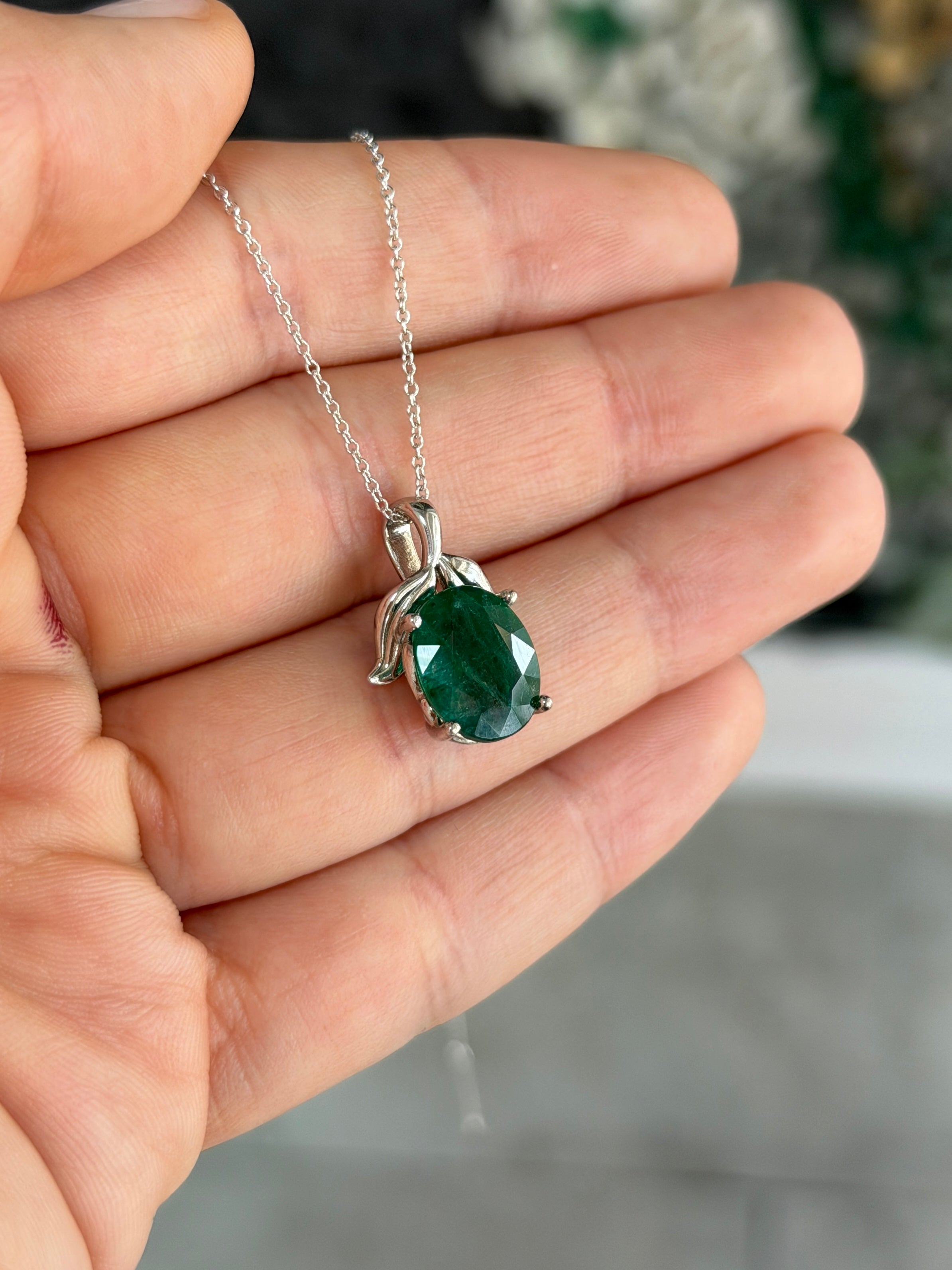 3.23 carat oval cut emerald pendant with leaf bail on platinum necklace, inspired by nature, from JR Colombian Emeralds.