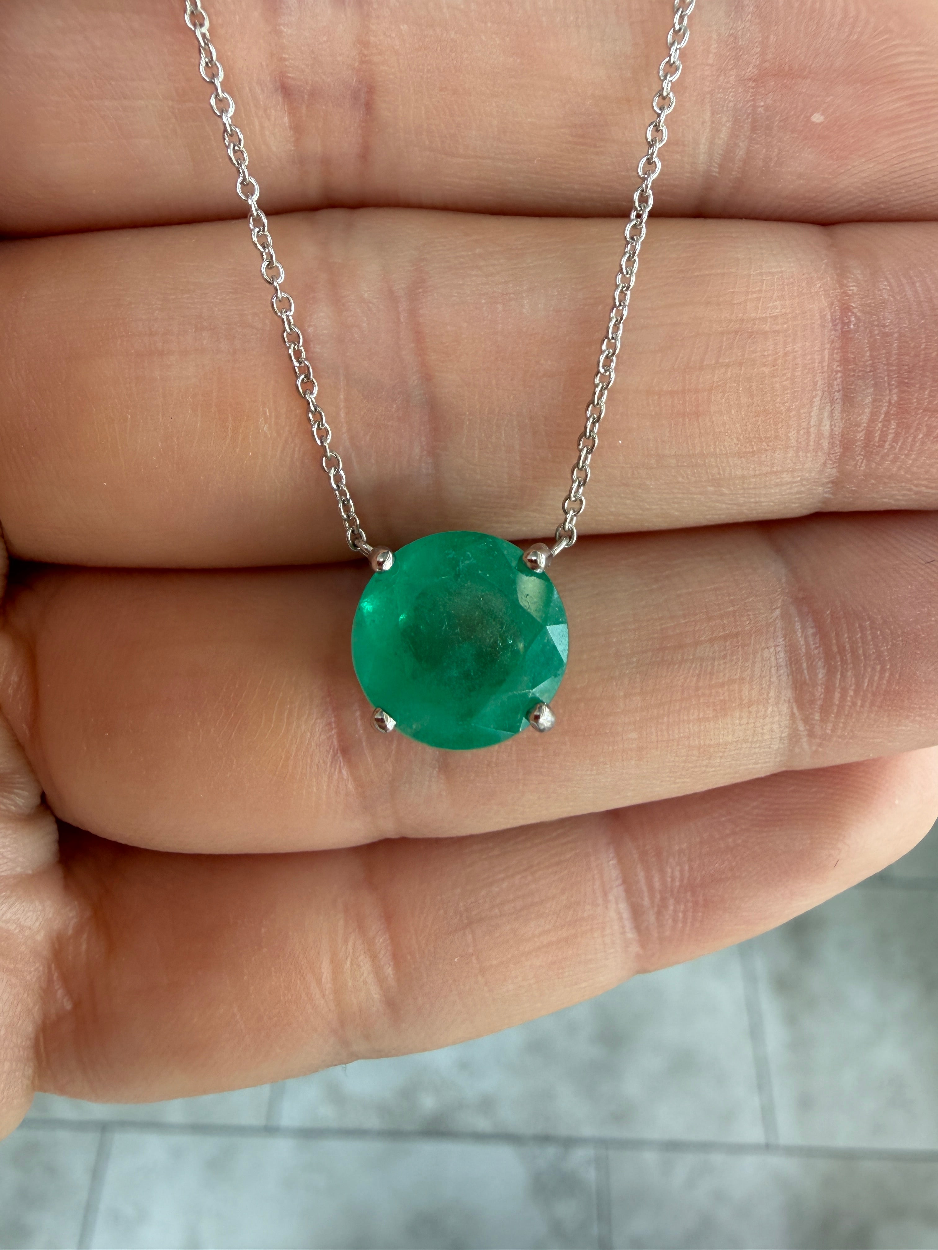 18K gold necklace featuring a rare 4.45ct natural round Colombian emerald in a stationary design by JR Colombian Emeralds.