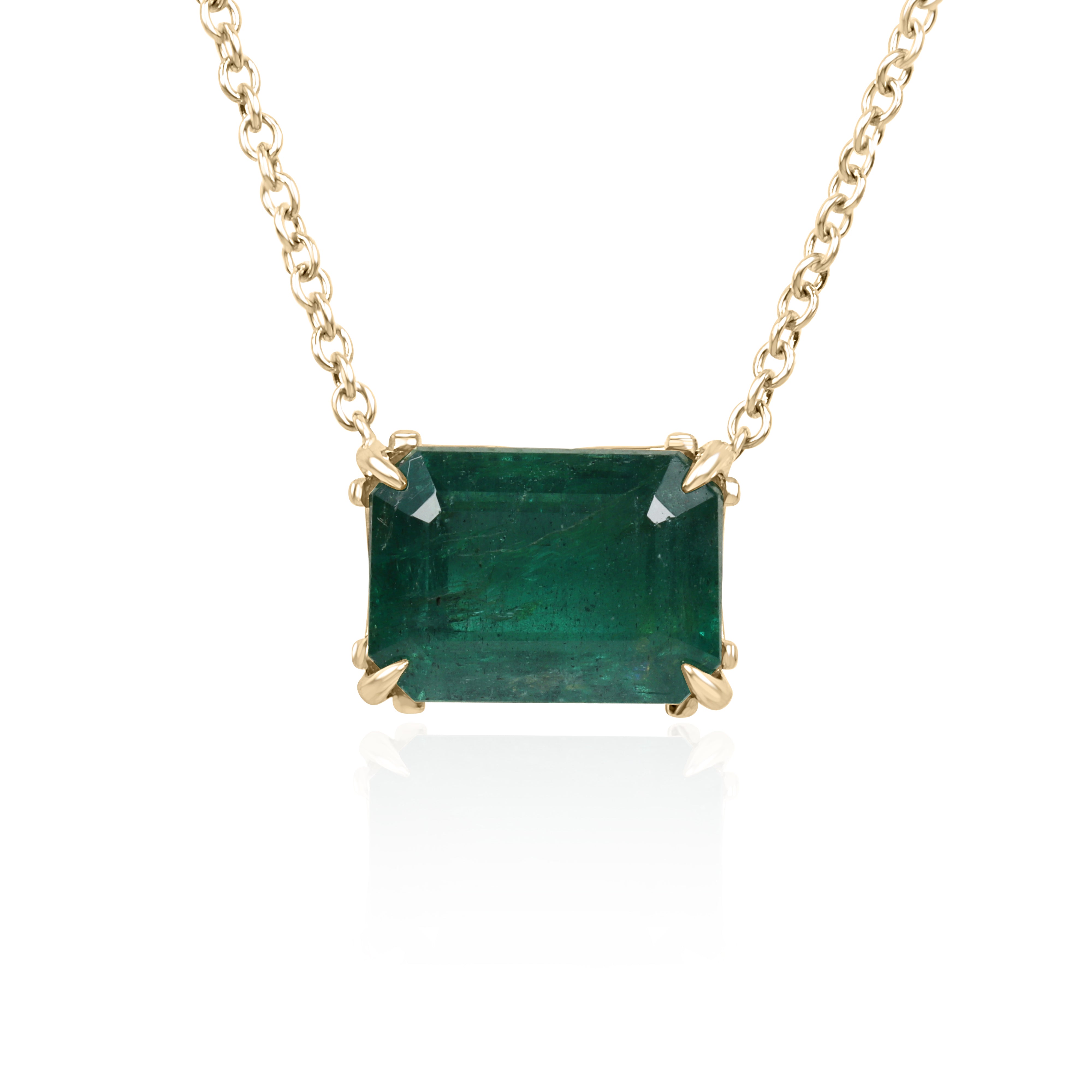 East to west emerald solitaire necklace with floral fleur de lis design, 5.70ct 18K gold from JR Colombian Emeralds.