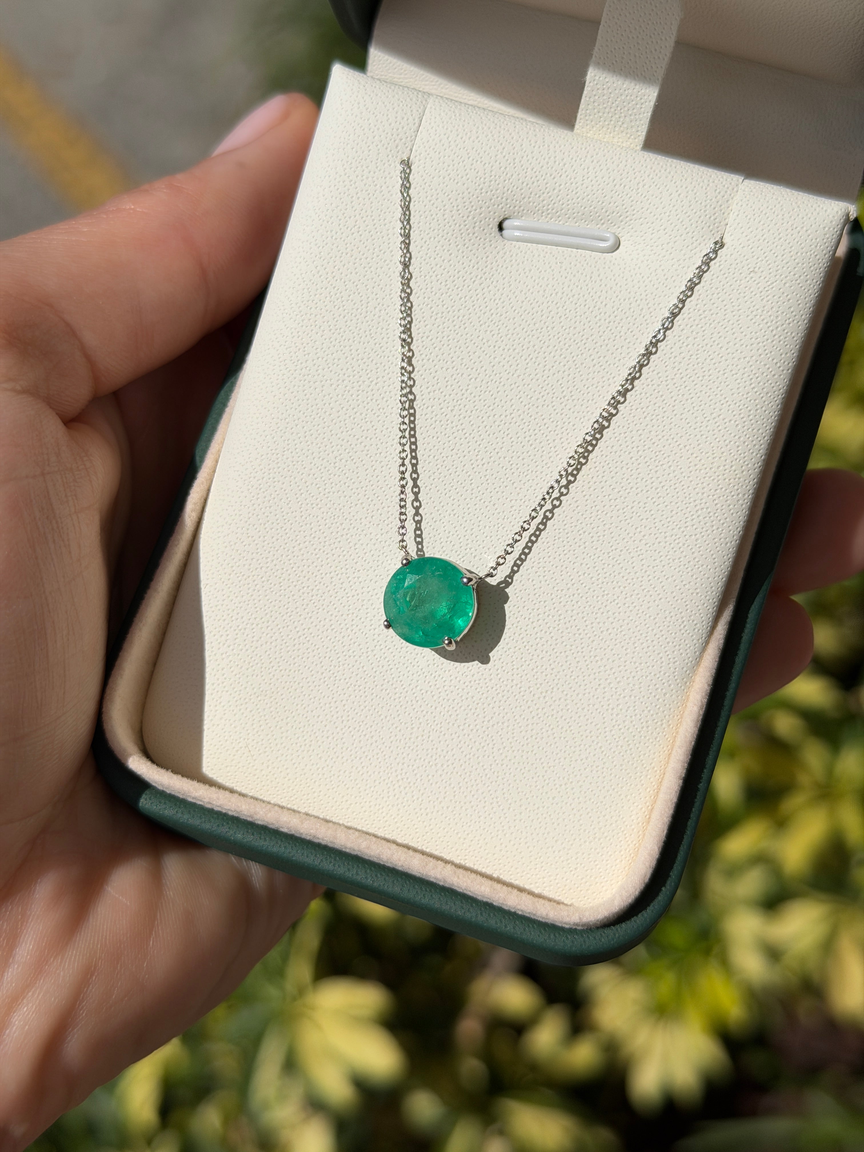 18K gold stationary necklace featuring a 4.45ct round Colombian emerald by JR Colombian Emeralds.