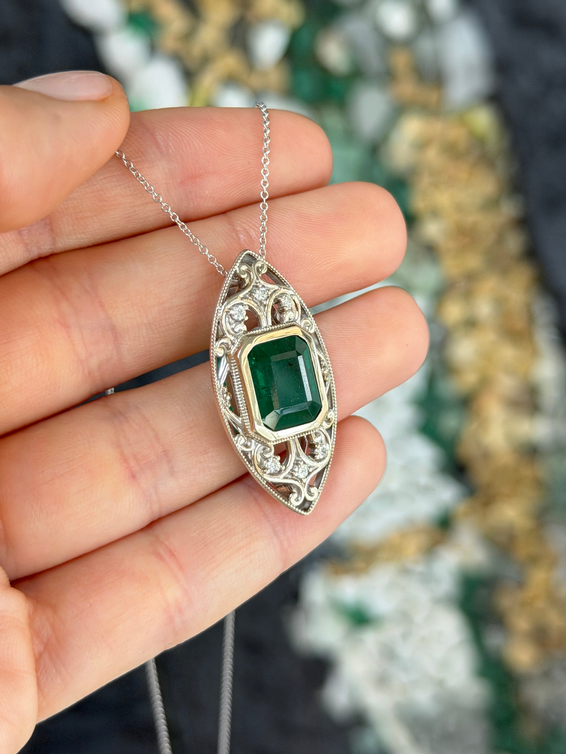 Art Deco-inspired emerald cut emerald and diamond slider necklace in 14K gold with vintage filigree details by JR Colombian Emeralds.