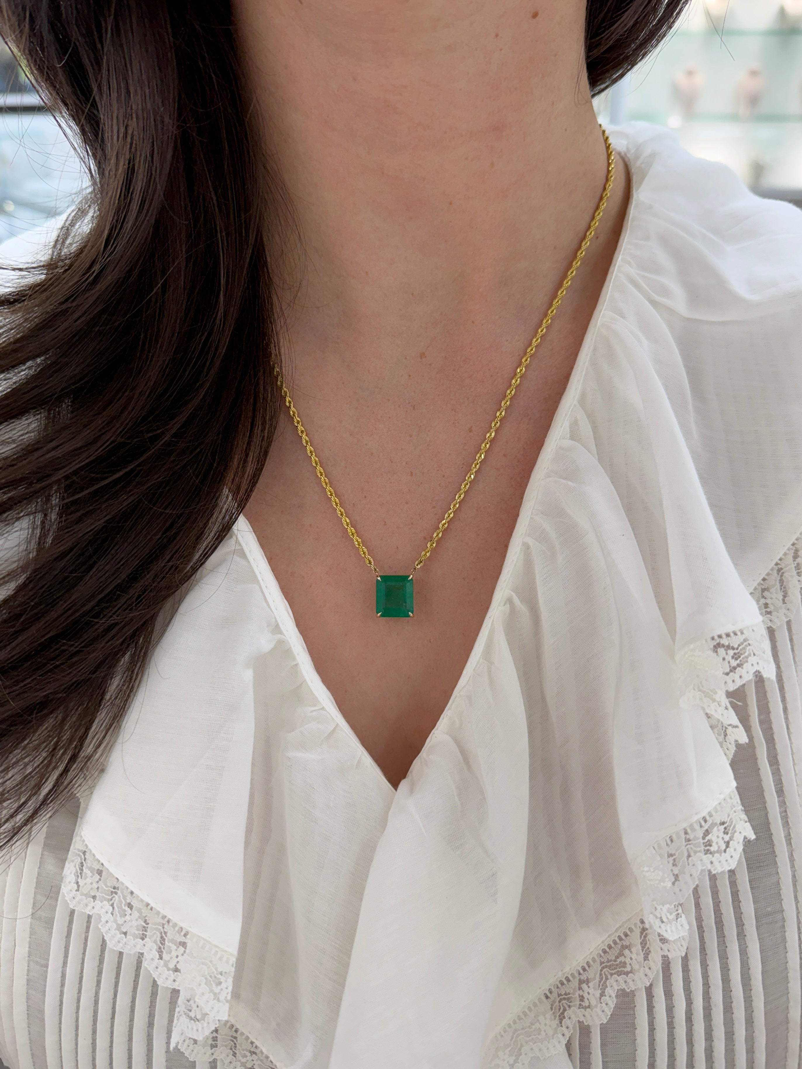 14K emerald cut emerald solitaire necklace with 10.38ct gemstone and 20-inch rope chain by JR Colombian Emeralds.