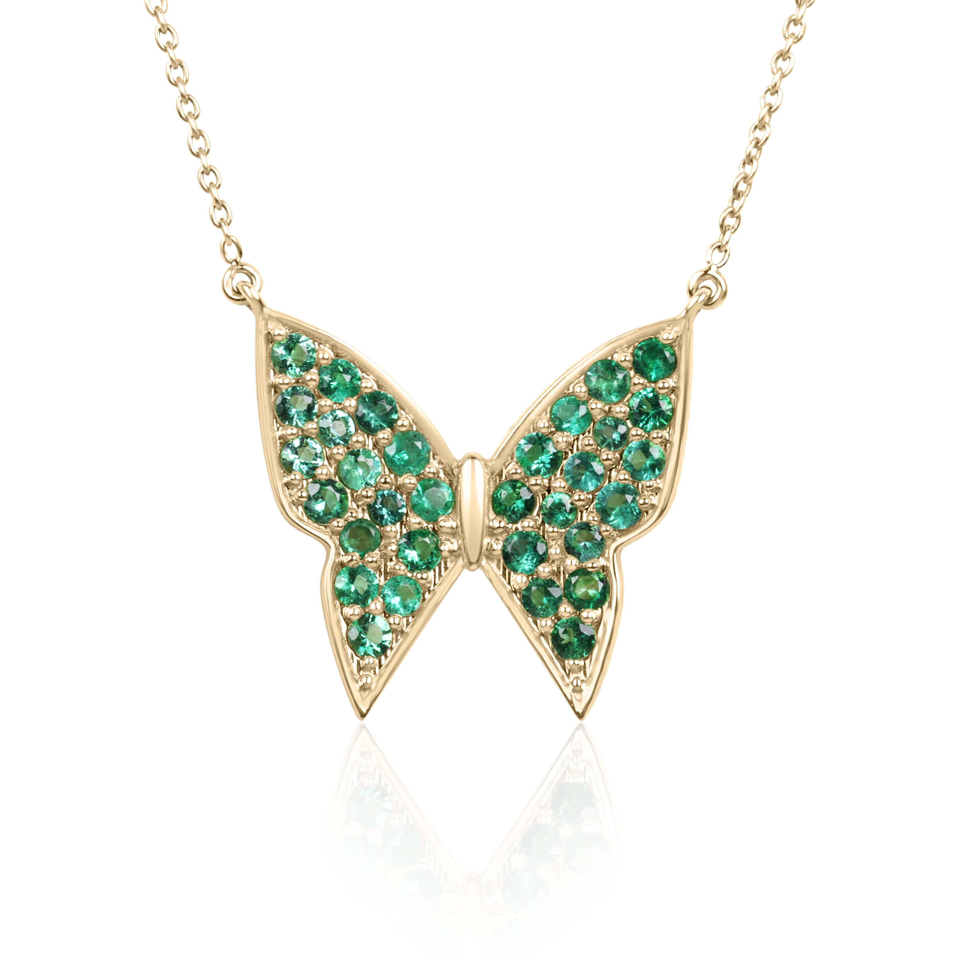 14K gold butterfly necklace with pave emeralds from JR Colombian Emeralds, featuring a fluttering butterfly design.