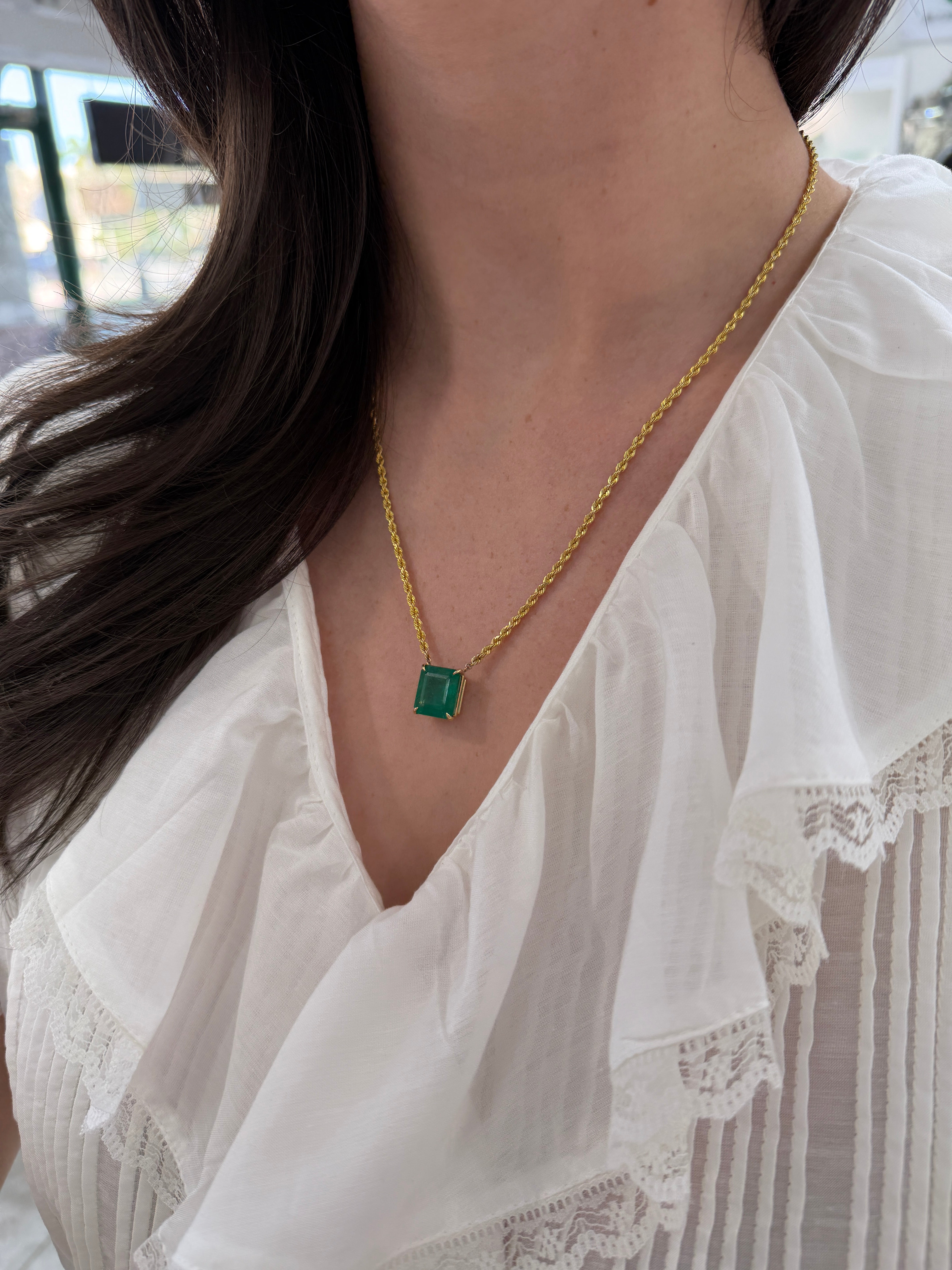 14K emerald cut emerald solitaire necklace with 20-inch rope chain by JR Colombian Emeralds, showing the pendant and chain details.