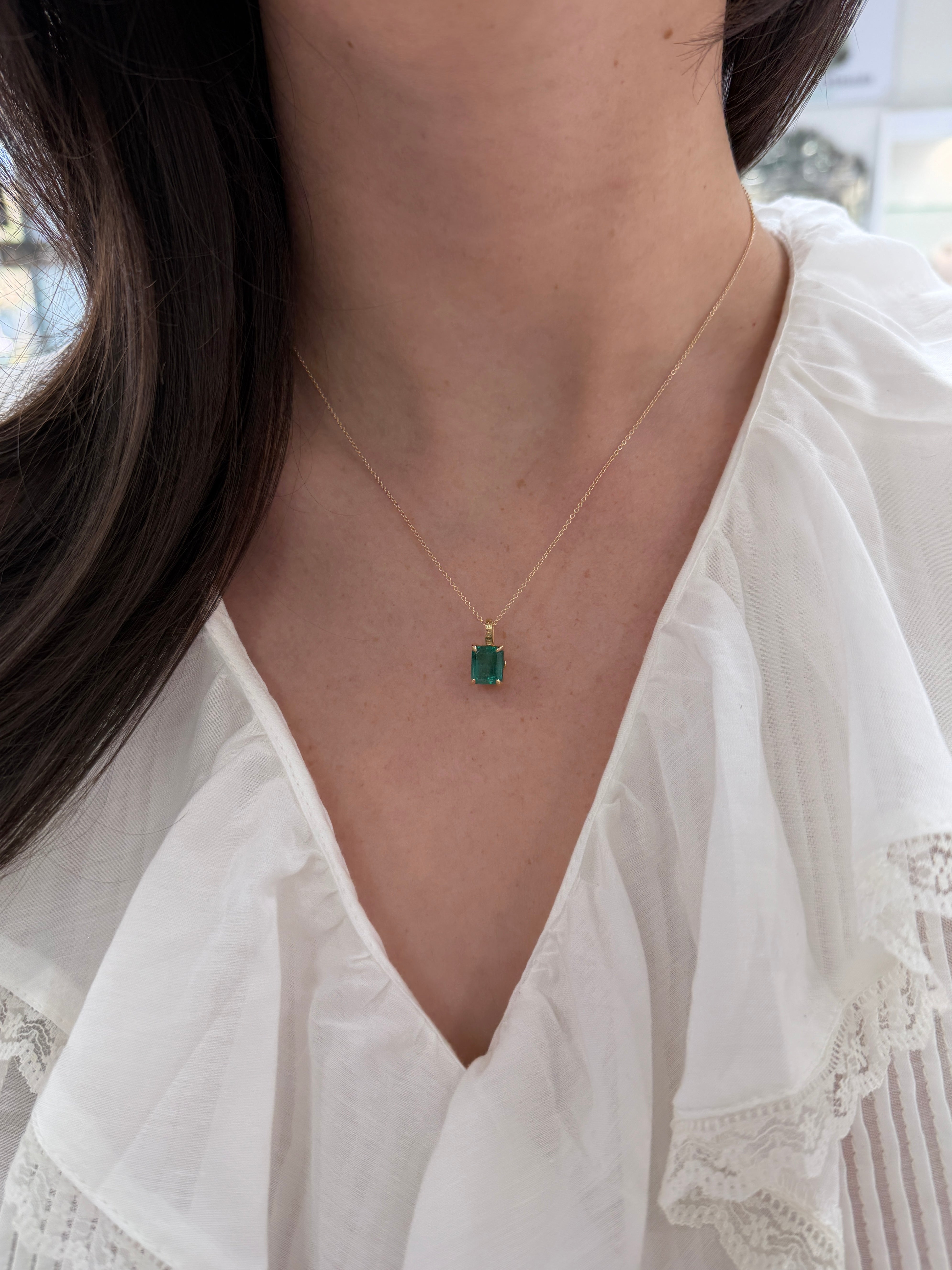 14K gold solitaire emerald necklace featuring a 3.50 carat fleur de lis design by JR Colombian Emeralds.