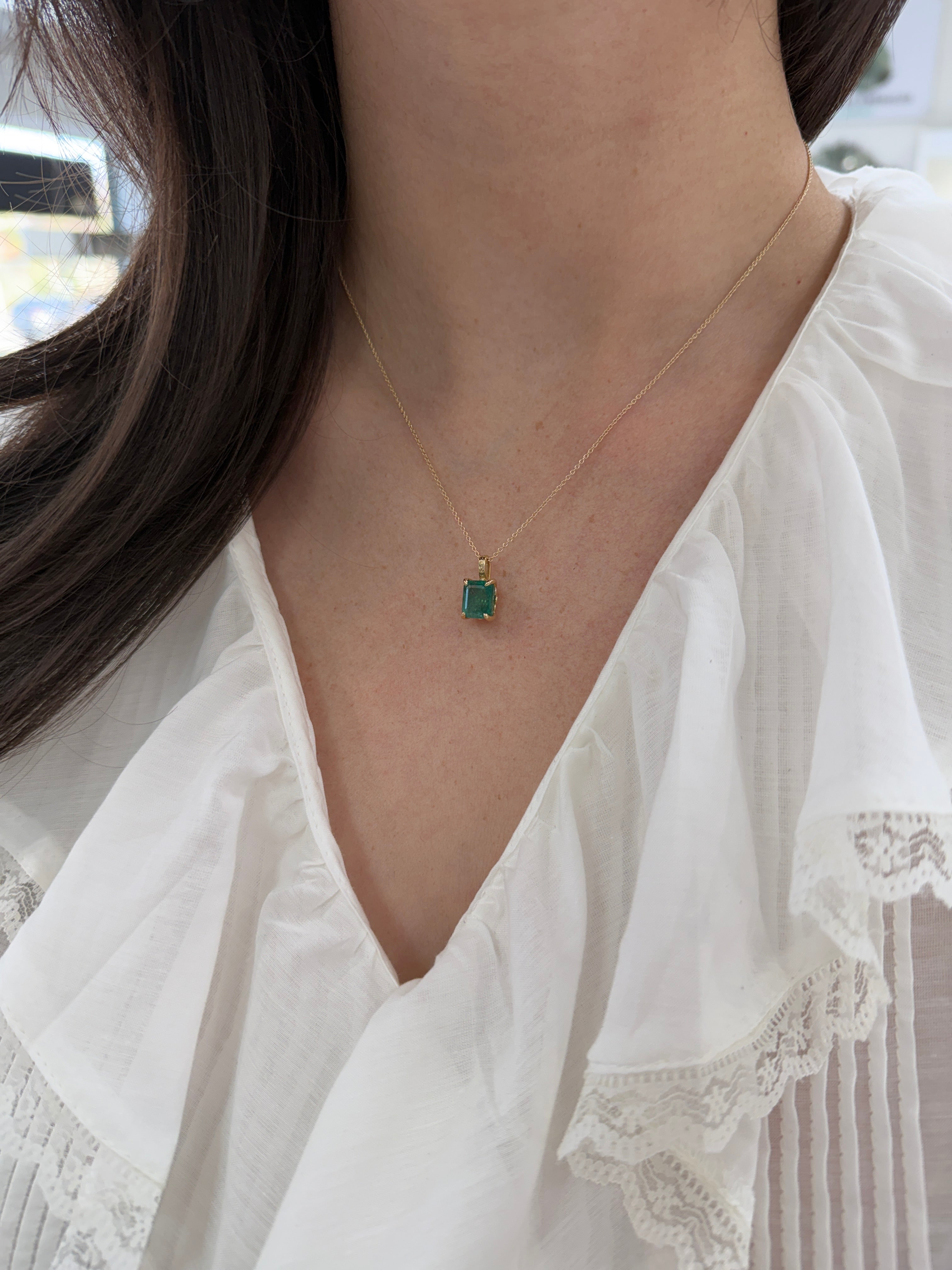14K gold emerald necklace with a 3.50 carat solitaire fleur de lis design by JR Colombian Emeralds
