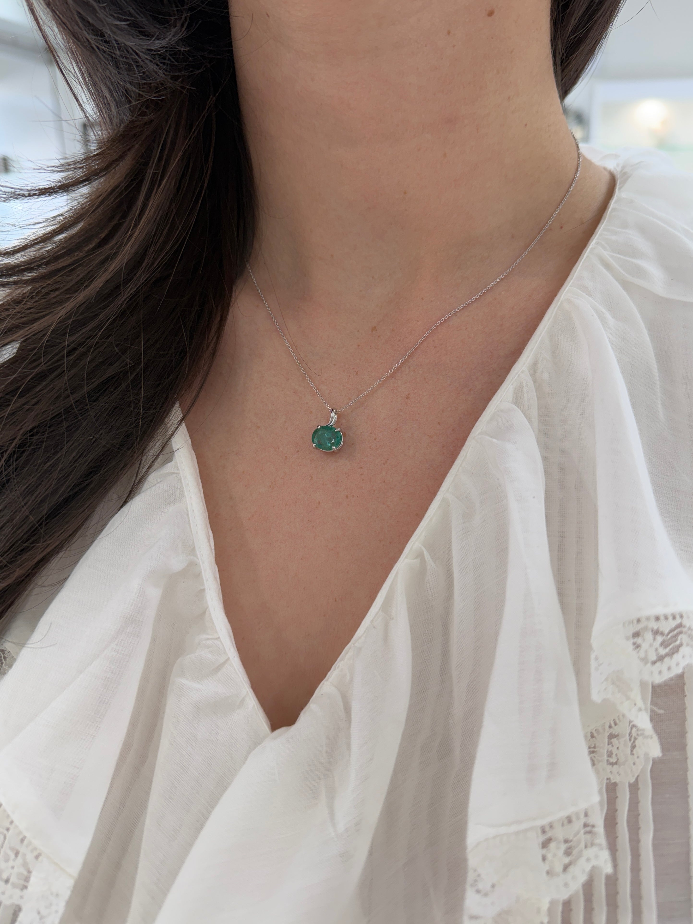 East to West oval emerald pendant necklace with leaf design in 14K white gold, 2.60ct earthy Colombian emerald from JR Colombian Emeralds