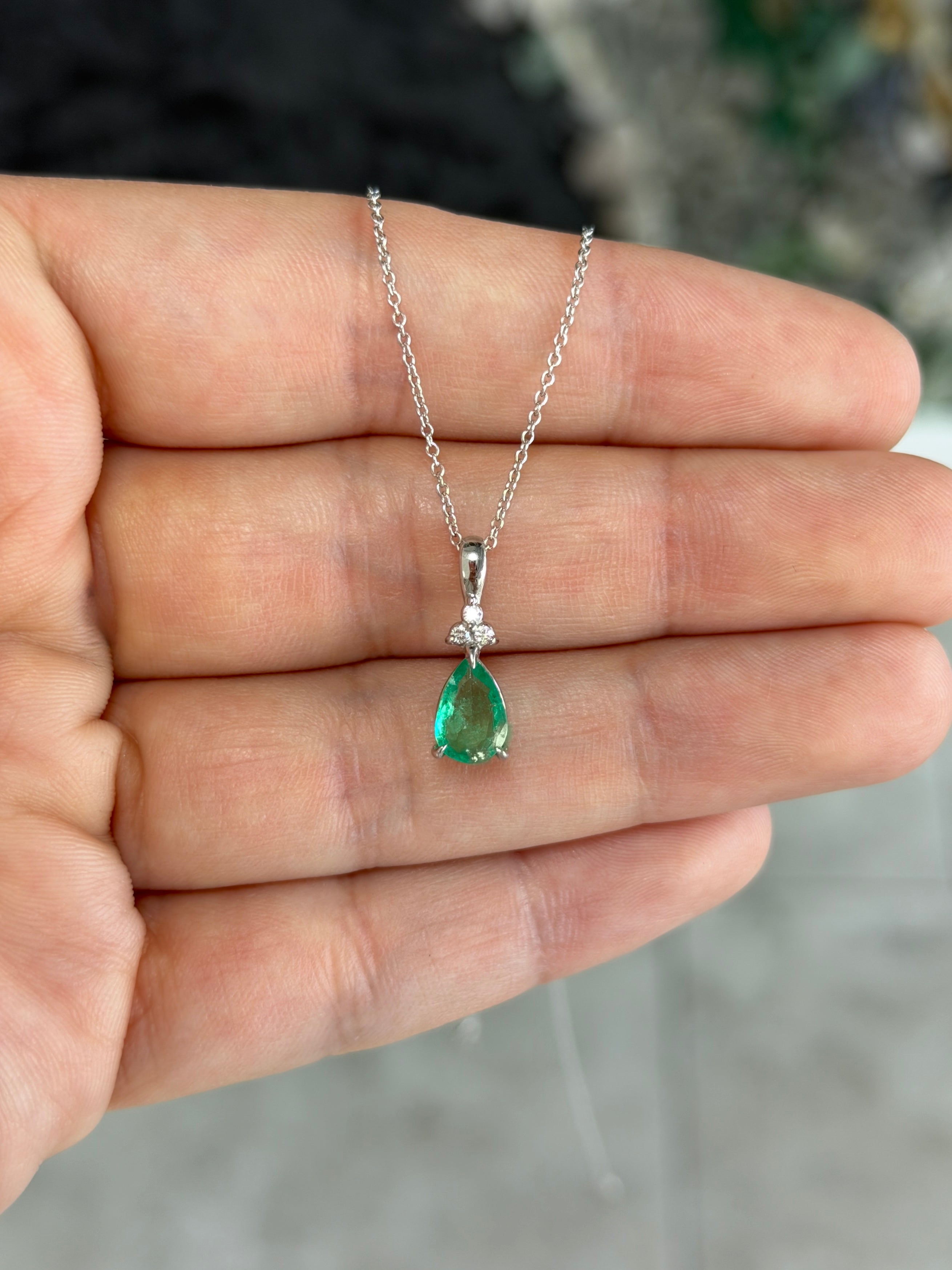 Pear-shaped emerald drop pendant with trefoil diamond cluster in 14K white gold by JR Colombian Emeralds.