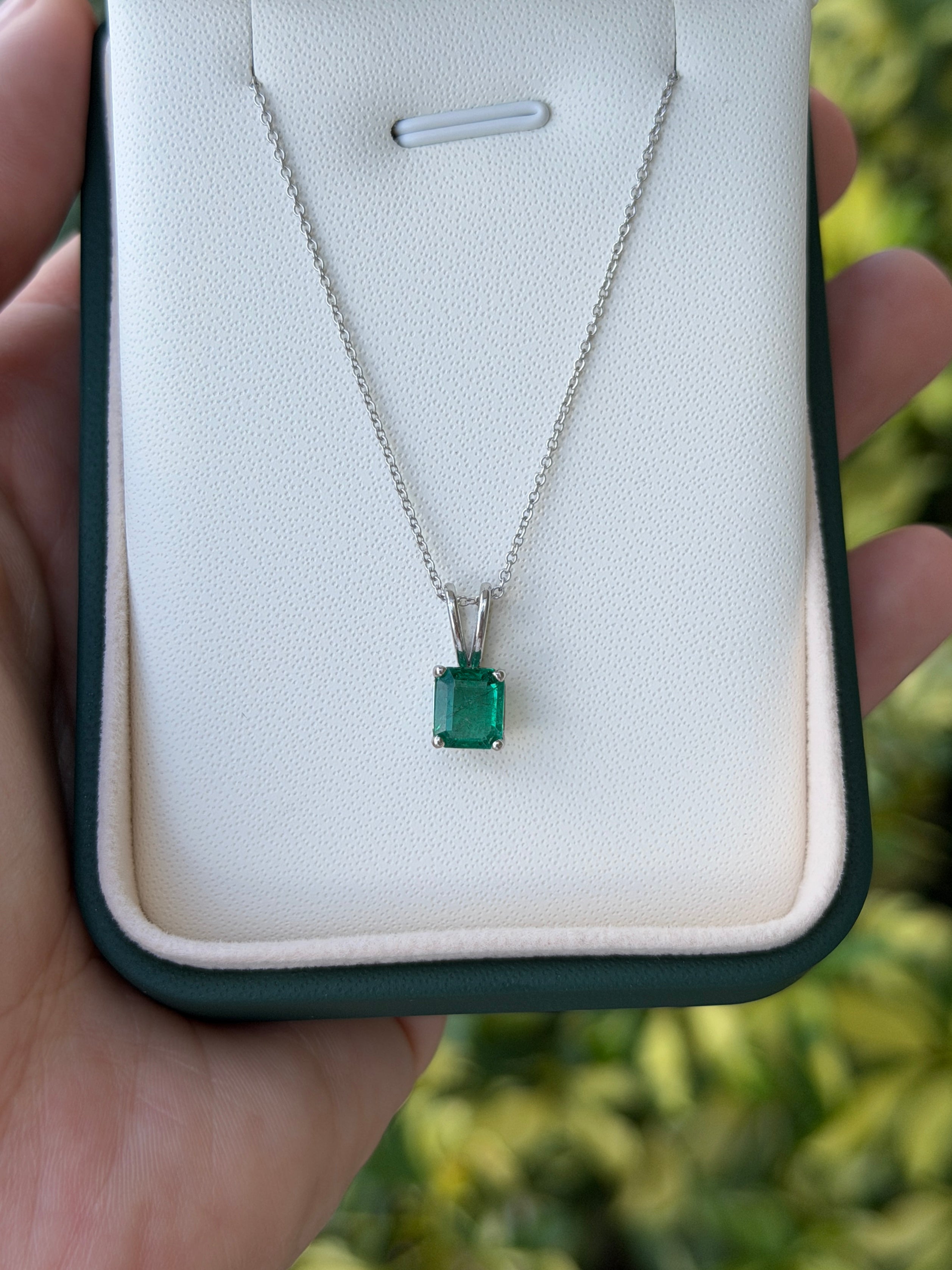 2.10ct platinum emerald solitaire necklace featuring a high-quality rich green Asscher cut emerald by JR Colombian Emeralds.